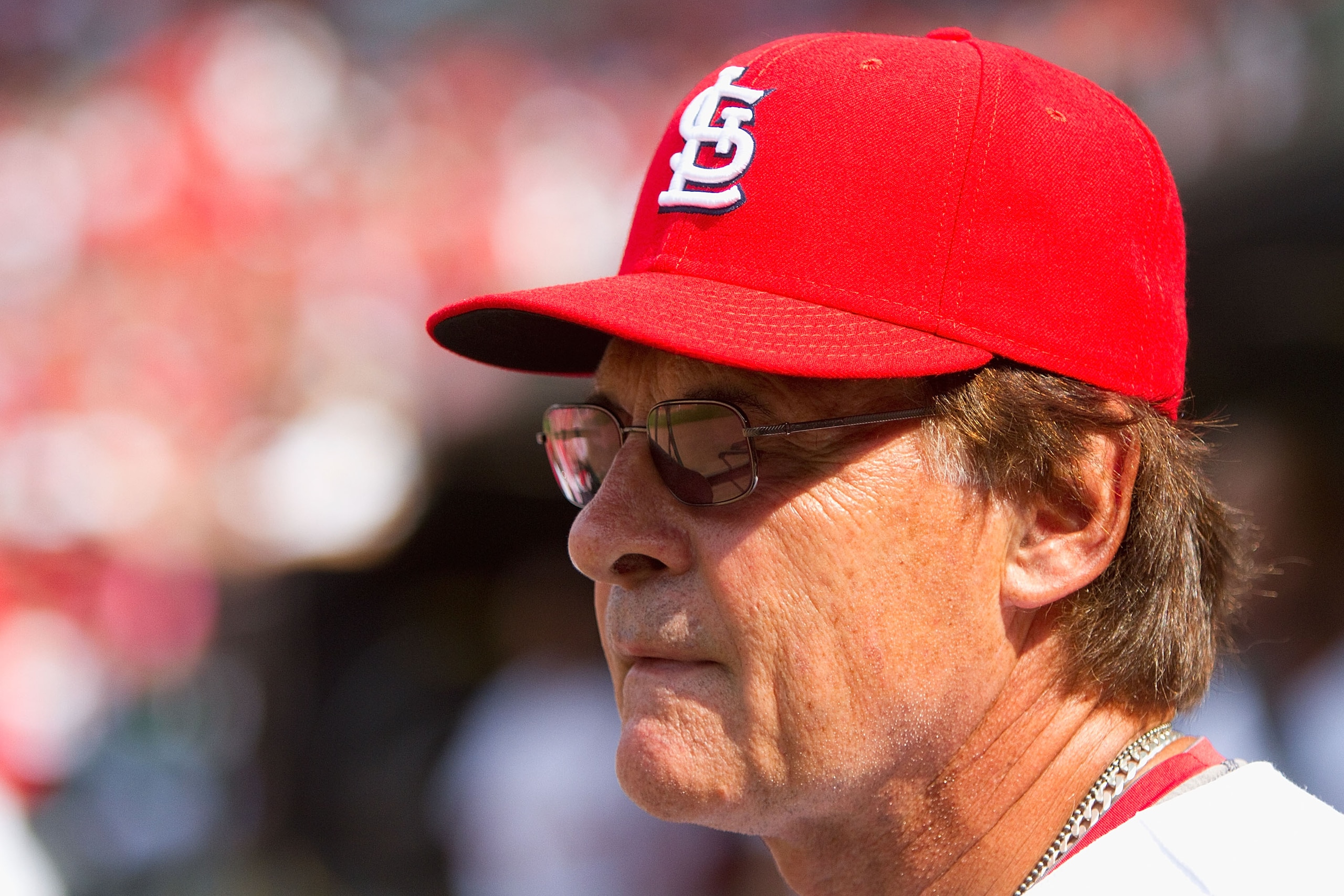 ST. LOUIS - AUGUST 18: Tony LaRussa #10 of the St. Louis Cardinals looks on from the dugout against the Milwaukee Brewers  at Busch Stadium on August 18, 2010 in St. Louis, Missouri.  The Brewers beat the Cardinals 3-2.  (Photo by Dilip Vishwanat/Getty Im