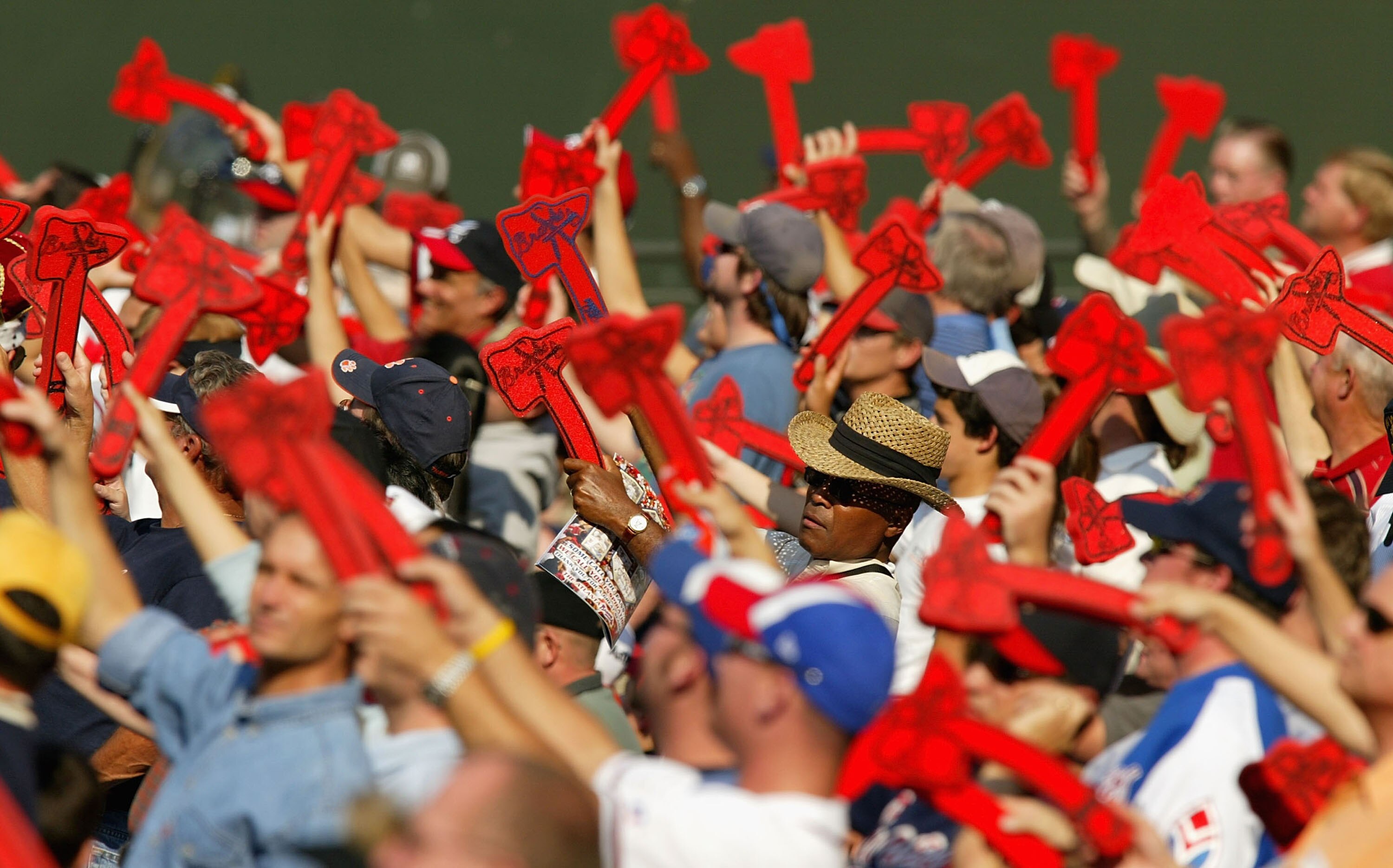 ATLANTA - OCTOBER 6:  Fans of the Atlanta Braves do the Tomahawk Chop during their game against the Houston Astros in game one of the National League Divisional Series on October 6, 2004 at Turner Field in Atlanta, Georgia.  (Photo by Streeter Lecka/Getty
