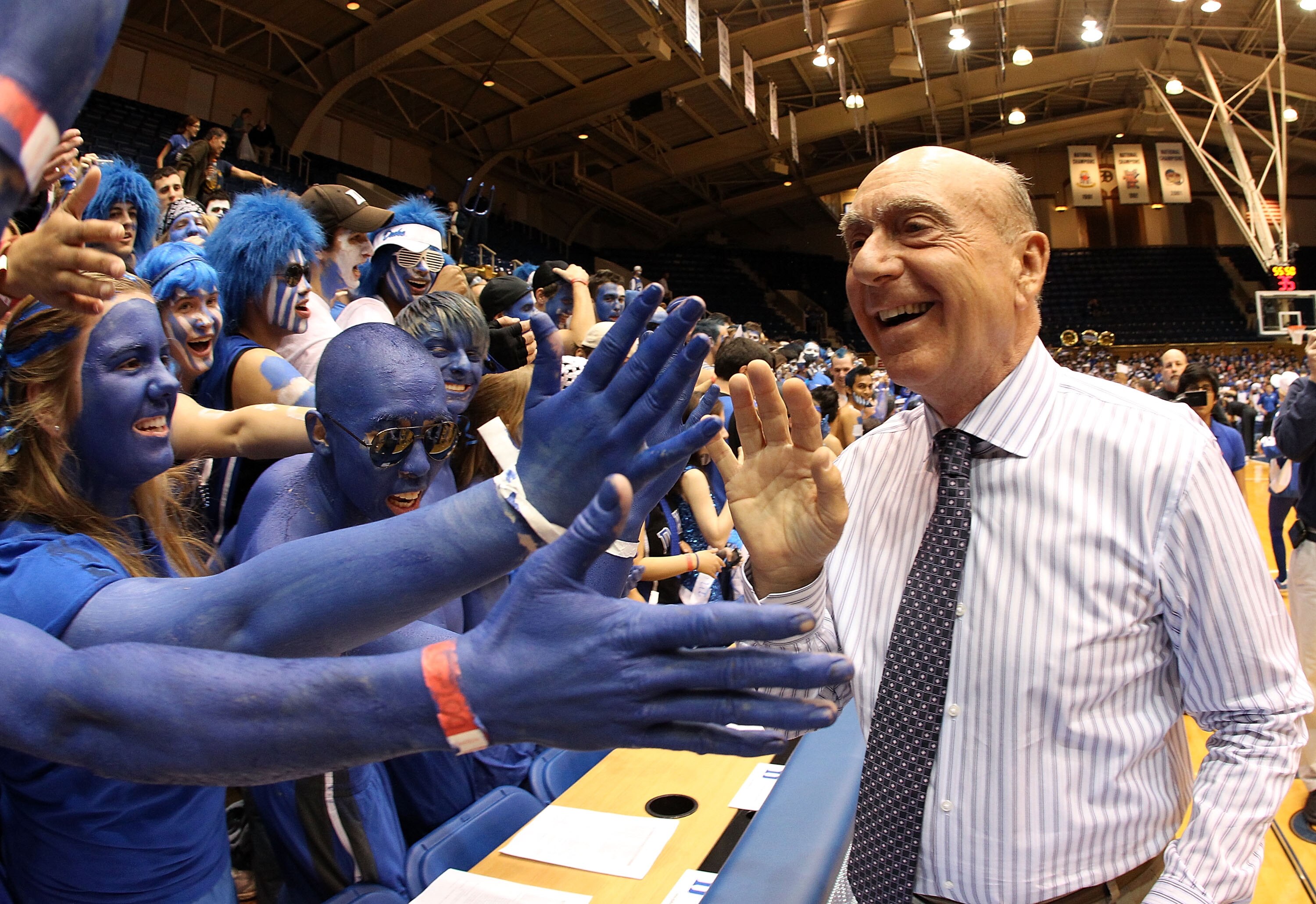 DURHAM, NC - MARCH 06:  ESPN analyst Dick Vitale celebrates with the Cameron Crazies before the start of the game between the North Carolina Tar Heels and Duke Blue Devils at Cameron Indoor Stadium on March 6, 2010 in Durham, North Carolina.  (Photo by St