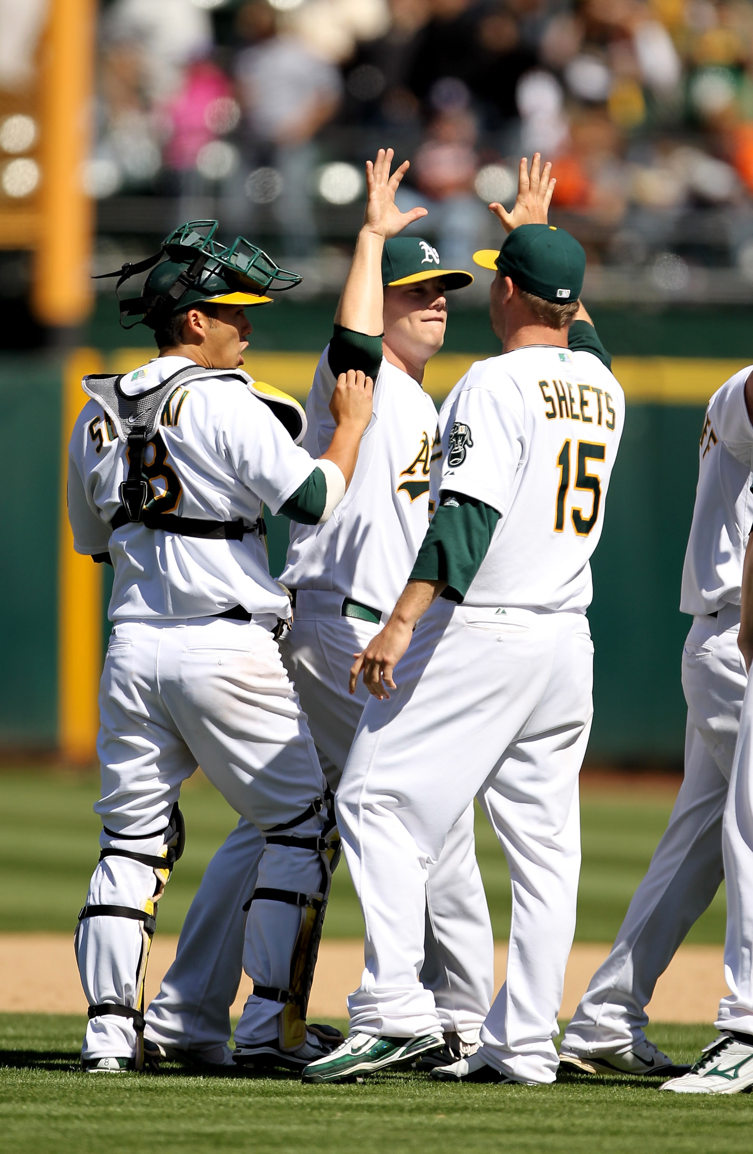 OAKLAND, CA - MAY 23:  Ben Sheets #15, Andrew Bailey #40 and  Kurt Suzuki #8 of the Oakland Athletics congratulate one another after the Athletics beat the San Francisco Giants at the Oakland-Alameda County Coliseum on May 23, 2010 in Oakland, California.