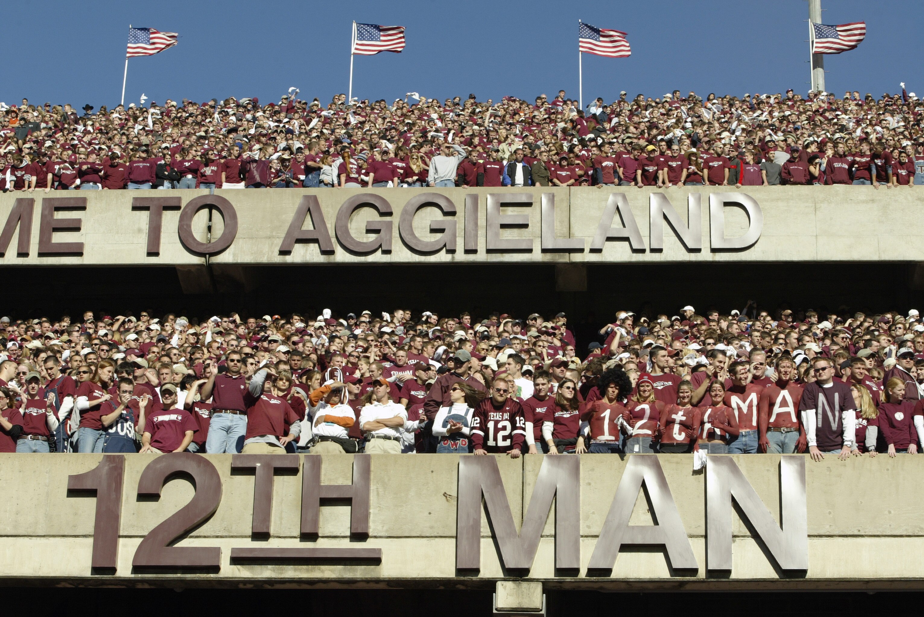 COLLEGE STATION, TX - NOVEMBER 28:  Texas A&M University Aggies fans, sometimes referred to as the 12th Man, stand during the game against the University of Texas at Austin Longhorns, at Kyle Field on November 28, 2003 in College Station, Texas.  The Texa