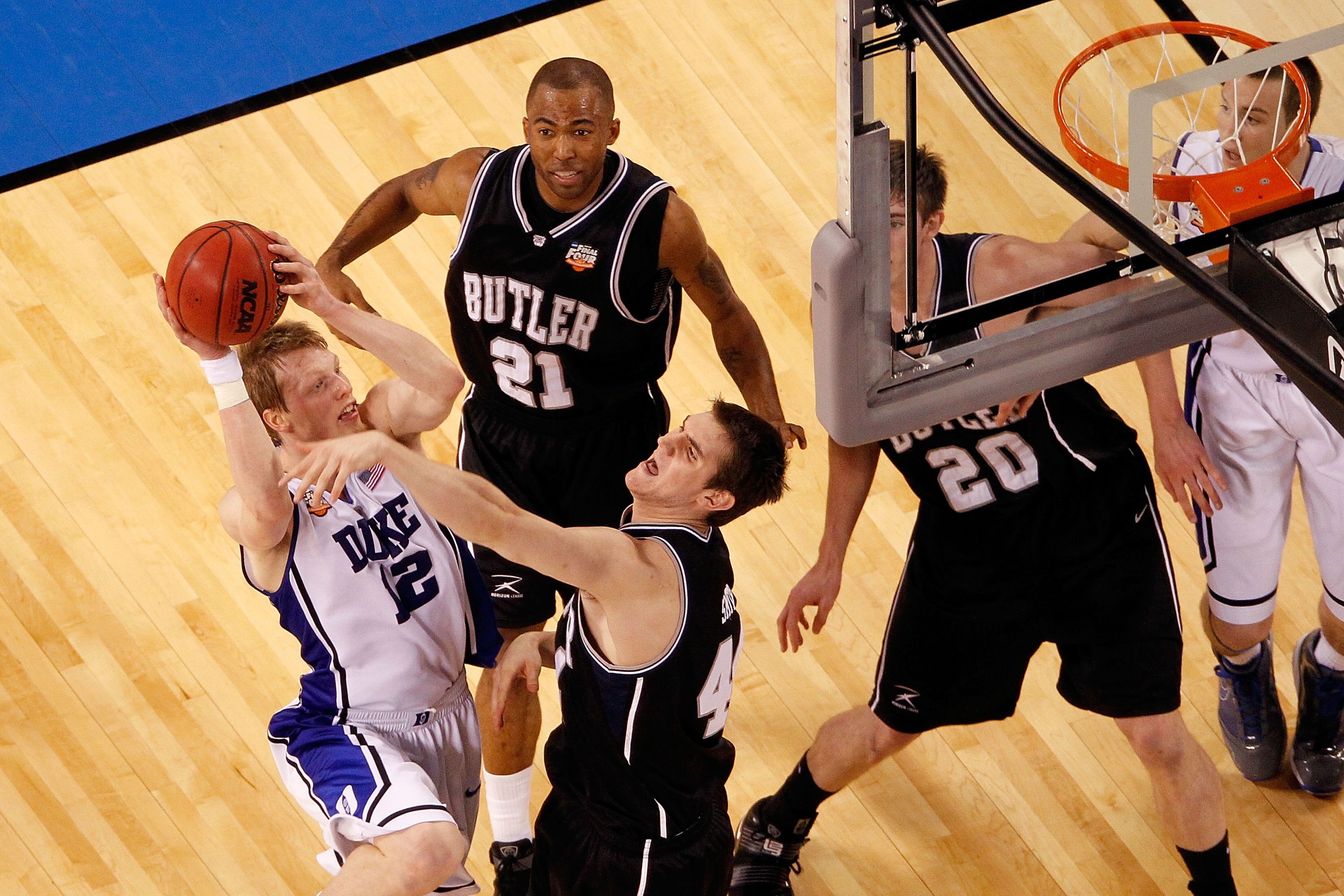 INDIANAPOLIS - APRIL 05:  Kyle Singler #12 of the Duke Blue Devils attempts a shot against the Butler Bulldogs during the 2010 NCAA Division I Men's Basketball National Championship game at Lucas Oil Stadium on April 5, 2010 in Indianapolis, Indiana.  (Ph