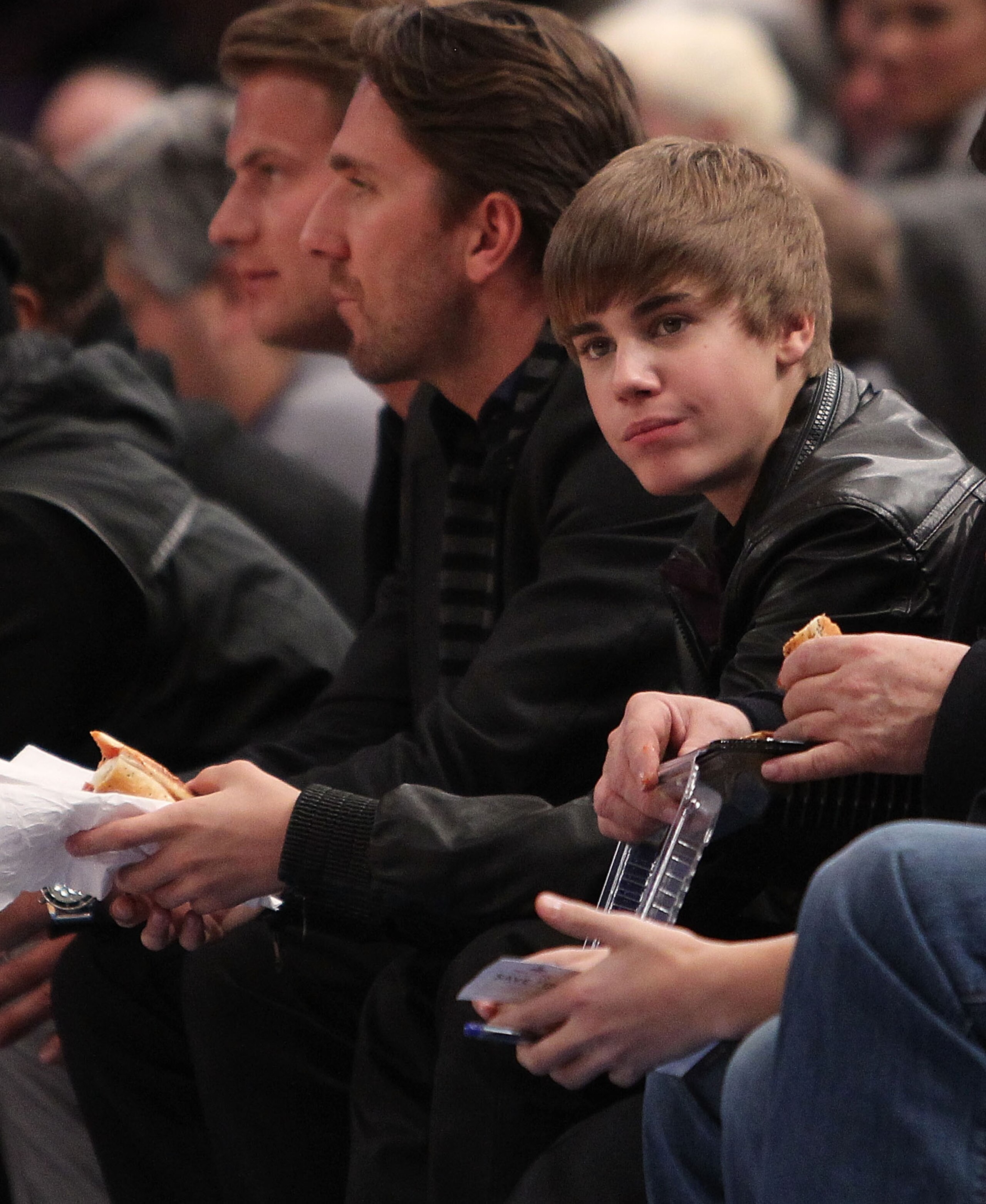 NEW YORK, NY - FEBRUARY 02:  Singer Justin Bieber sits courtside during the game between the New York Knicks and the Dallas Mavericks at Madison Square Garden on February 2, 2011 in New York City. NOTE TO USER: User expressly acknowledges and agrees that,
