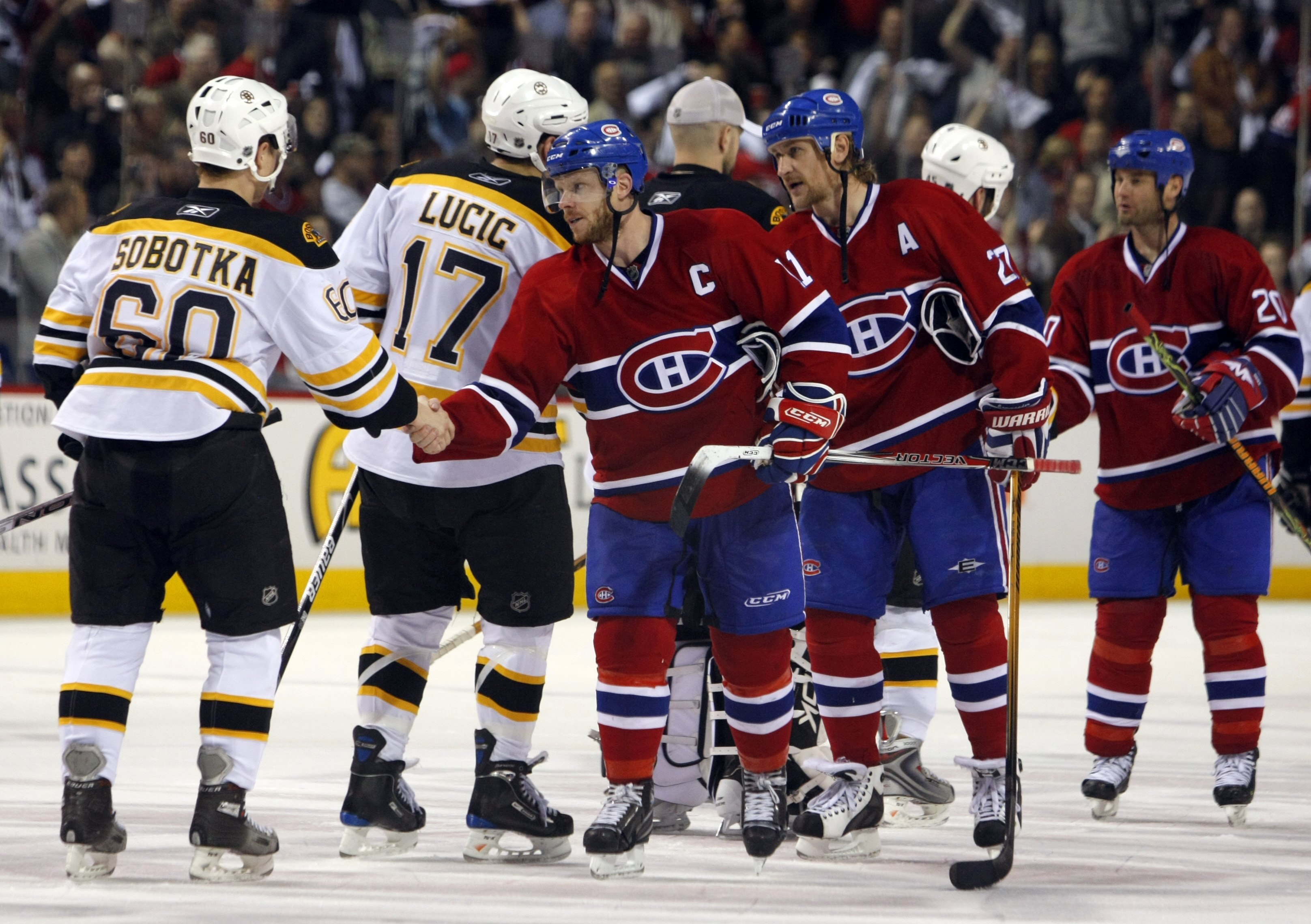 MONTREAL - APRIL 21:  Saku Koivu #11 of the Montreal Canadiens shakes hands with Vladimir Sobotka #60 of the Boston Bruins during the traditional post series handshake line after game seven of the 2008 NHL Eastern Conference Quarterfinals on April 21, 200