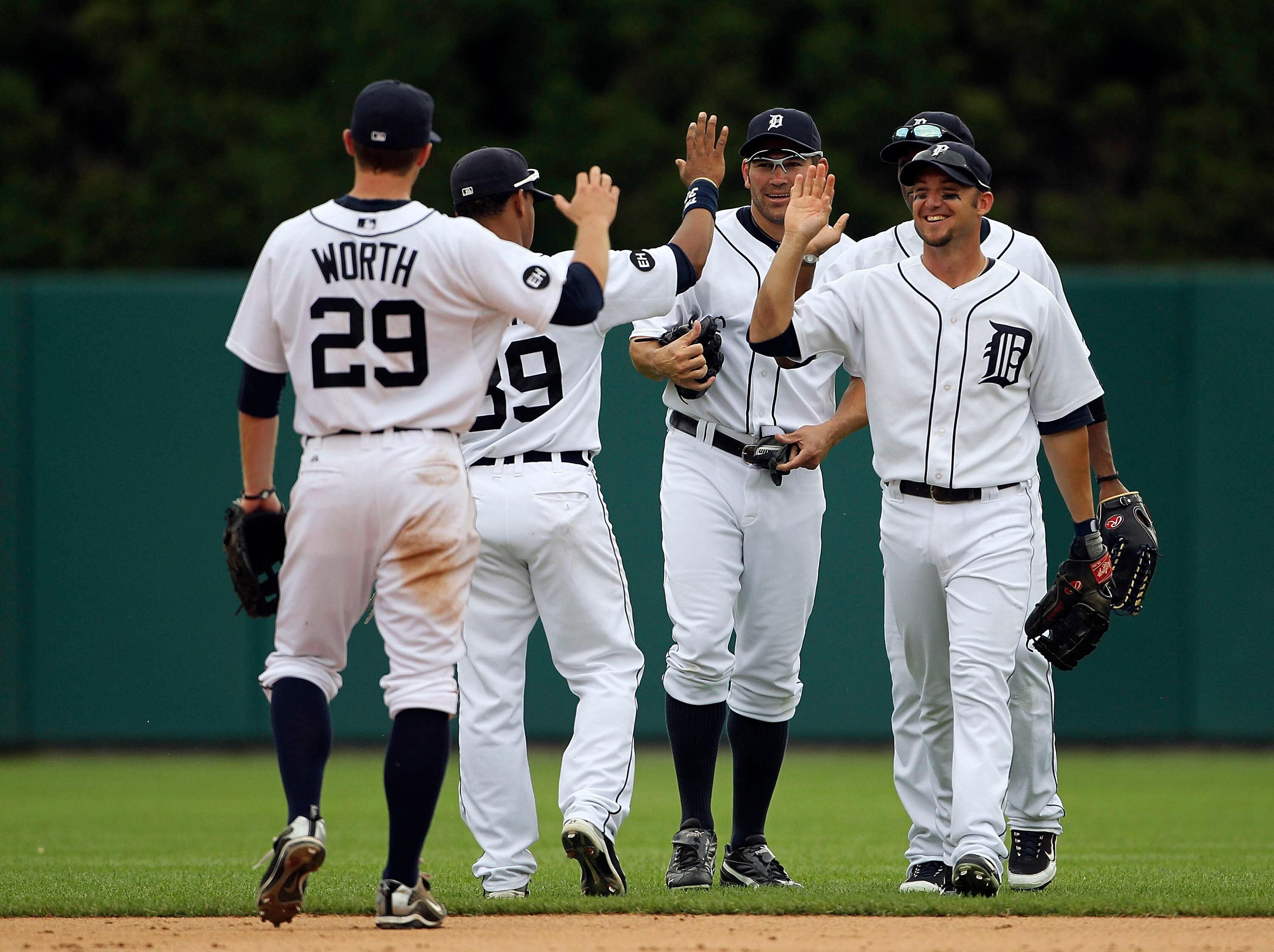 DETROIT - JULY 22: Ryan Raburn #25 of the Detroit Tigers celebrates a 5-2 win over the Toronto Blue Jays with his teammates during the game on July 22, 2010 at Comerica Park in Detroit, Michigan. (Photo by Leon Halip/Getty Images)