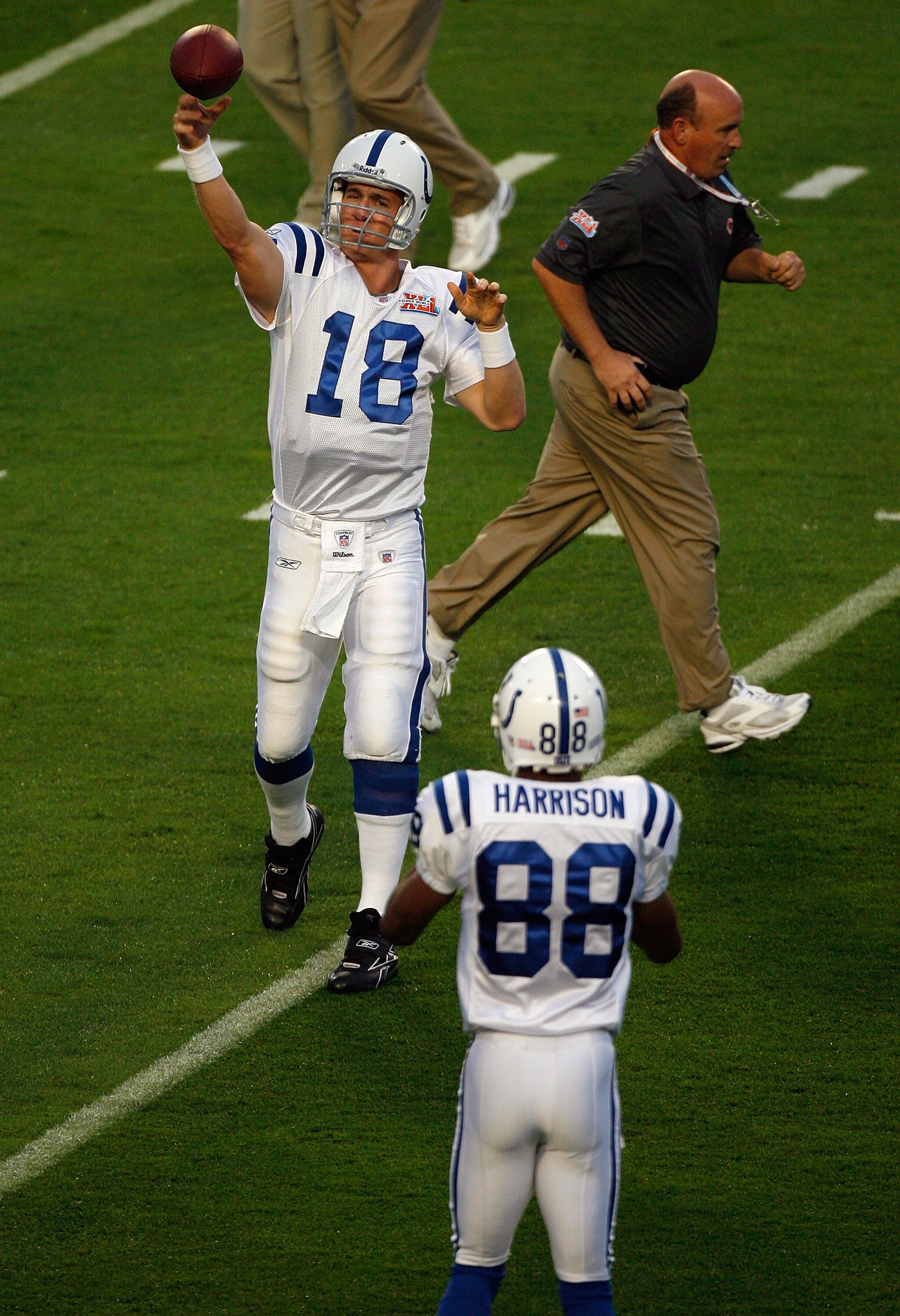 MIAMI GARDENS, FL - FEBRUARY 04:  Peyton Manning #18 of the Indianapolis Colts throws passes to Marvin Harrison #88 during warm-ups prior to the start of Super Bowl XLI against the Chicago Bears on February 4, 2007 at Dolphin Stadium in Miami Gardens, Flo
