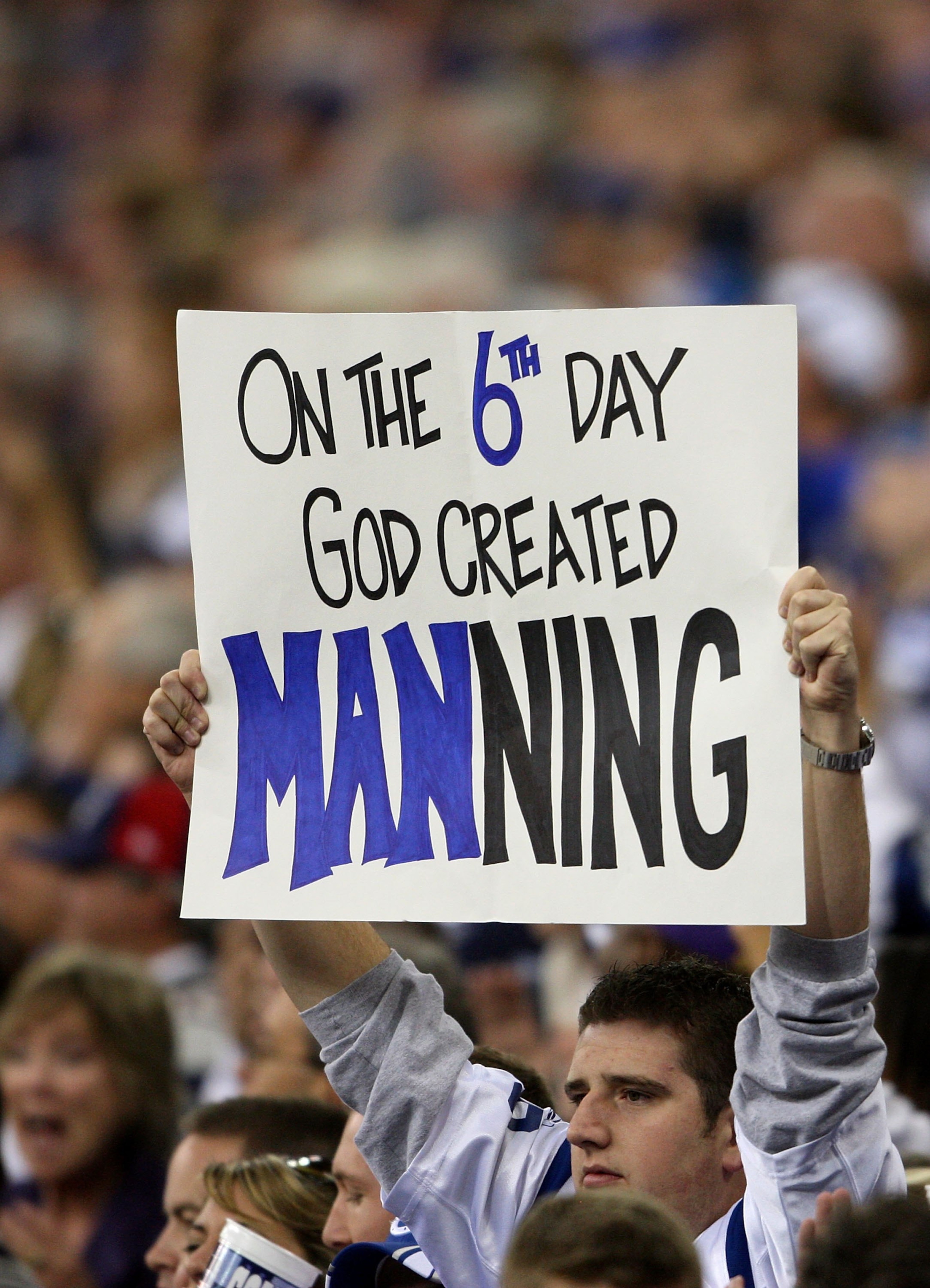 INDIANAPOLIS - NOVEMBER 04:  A fan of the Indianapolis Colts hold sup a sign in support of quarterback Peyton Manning #18 against the New England Patriots on November 4, 2007 at the RCA Dome in Indianapolis, Indiana. The Patriots won 24-20.  (Photo by And