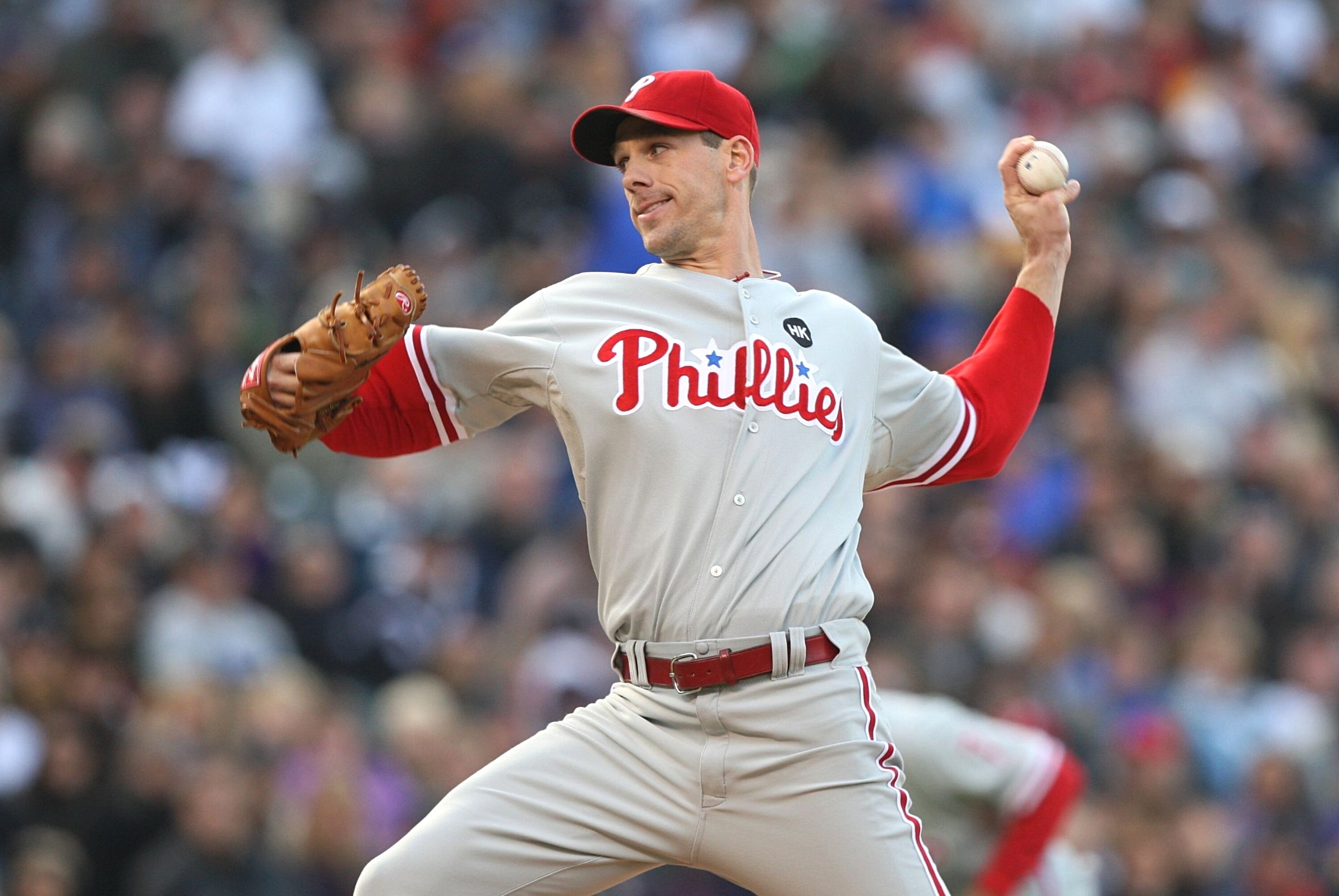 DENVER - OCTOBER 11:  Cliff Lee #34 of the Philadelphia Phillies pitches against the Colorado Rockies in Game Four of the NLDS during the 2009 MLB Playoffs at Coors Field on October 12, 2009 in Denver, Colorado. (Photo by Jed Jacobsohn/Getty Images)
