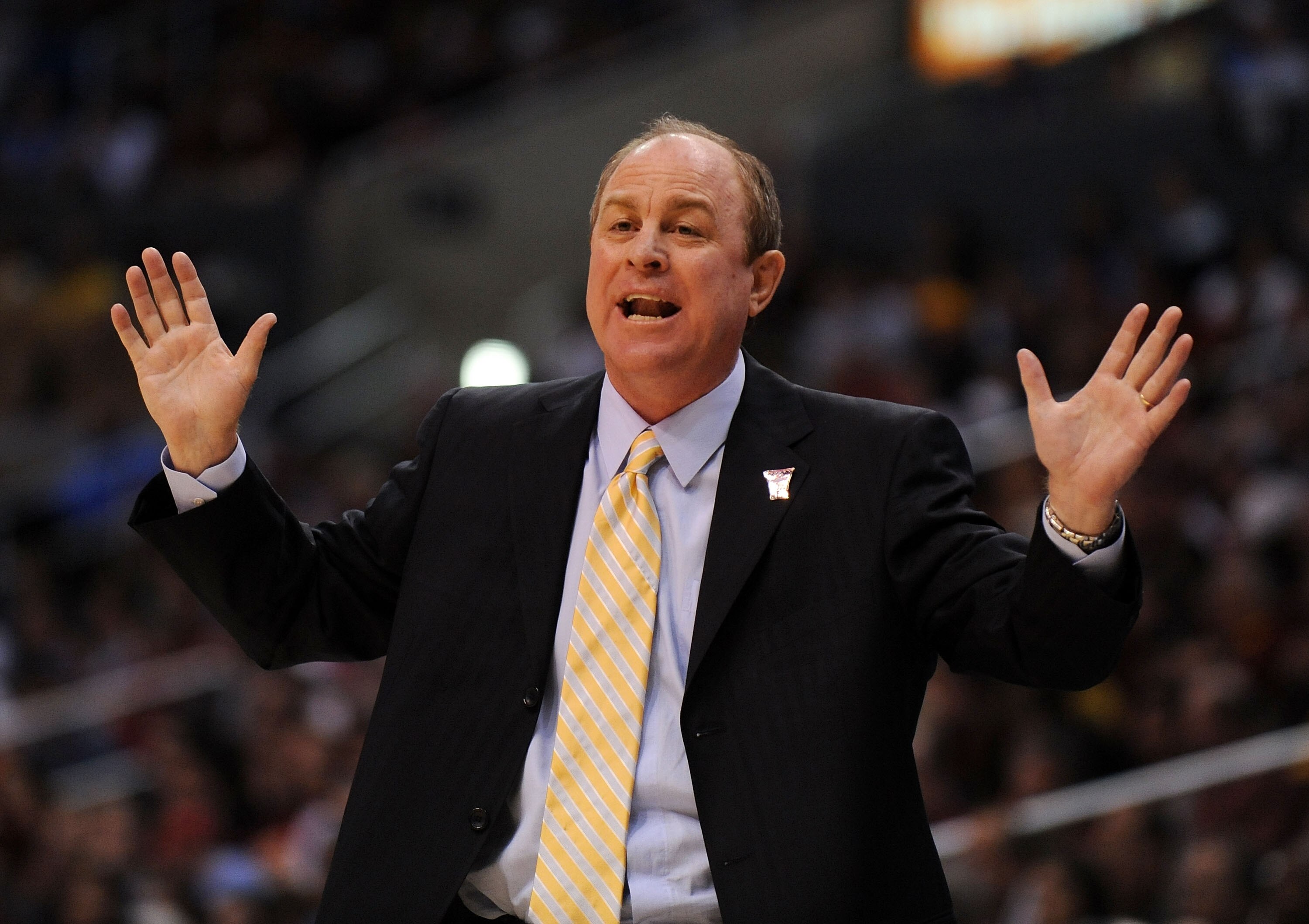 LOS ANGELES, CA - MARCH 13:  Head coach of the UCLA Bruins Ben Howland talks with his team from the sideline during their game against the USC Trojans in the Pacific Life Pac-10 Men's Basketball Tournament at the Staples Center on March 13, 2009 in Los An