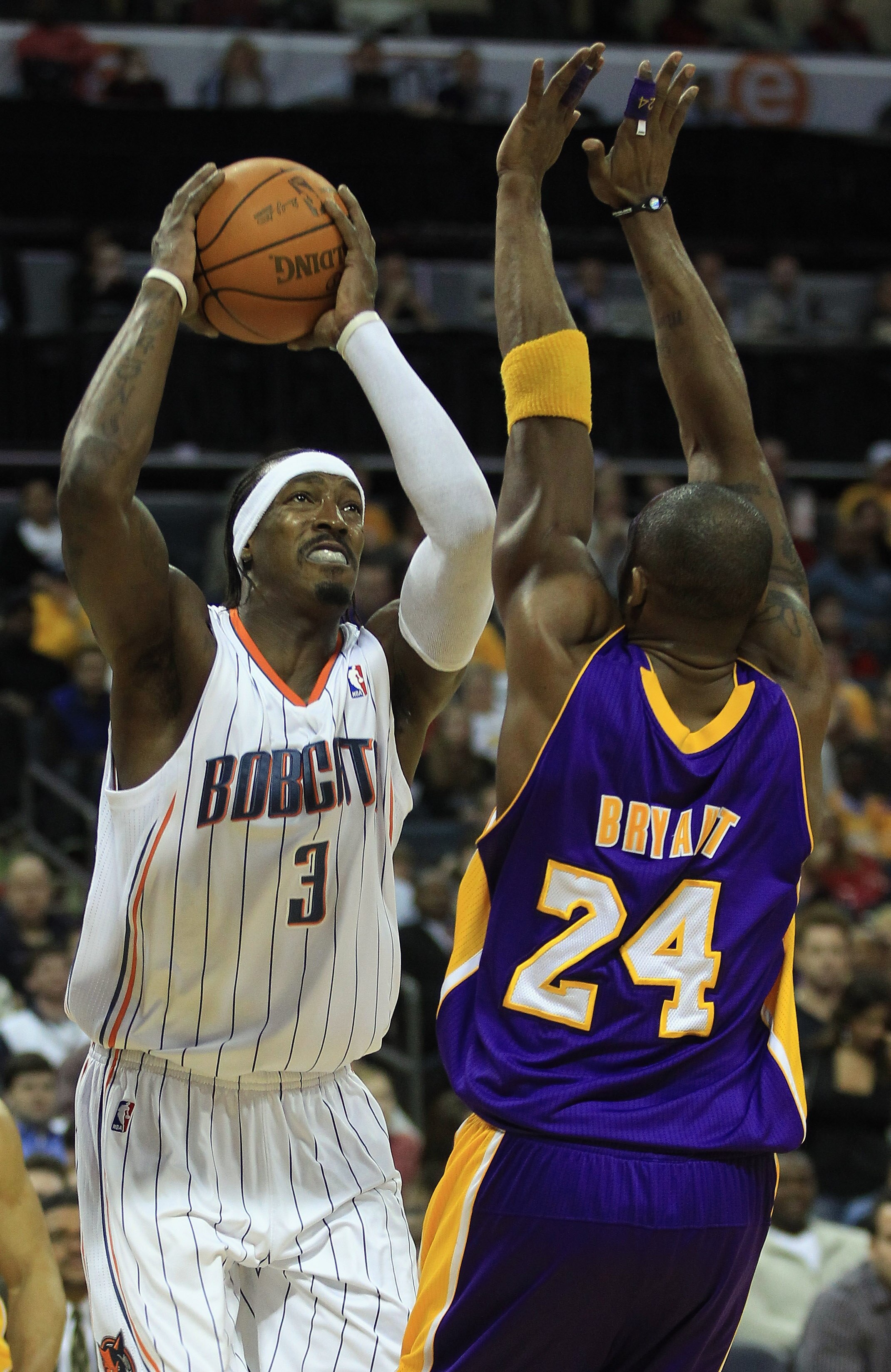 CHARLOTTE, NC - FEBRUARY 14:  Kobe Bryant #24 of the Los Angeles Lakers tries to stop Gerald Wallace #3 of the Charlotte Bobcats during their game at Time Warner Cable Arena on February 14, 2011 in Charlotte, North Carolina. NOTE TO USER: User expressly a