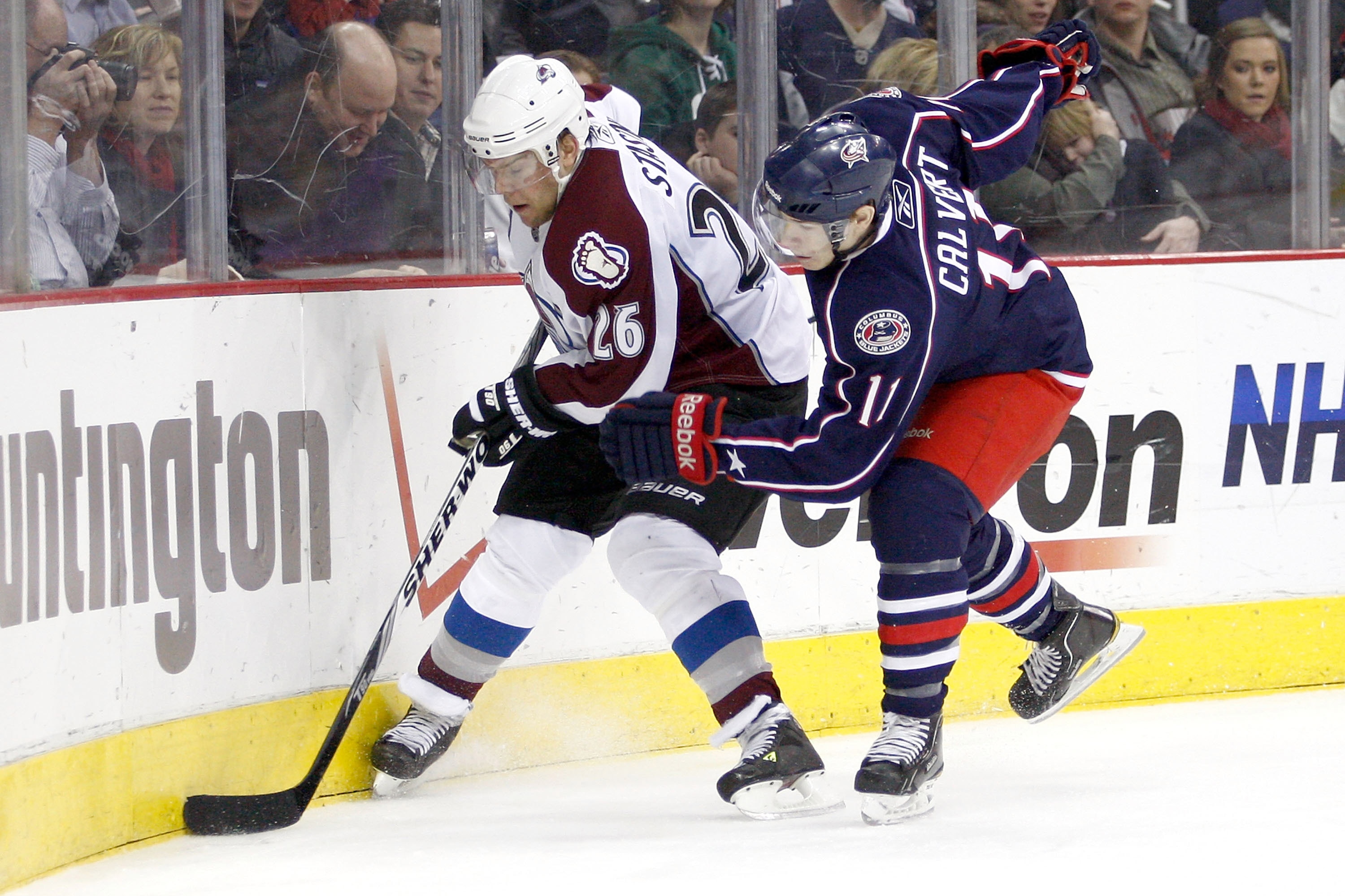 COLUMBUS, OH - FEBRUARY 11:  Paul Stastny #26 of the Colorado Avalanche is checked by Matt Calvert #11 of the Columbus Blue Jackets on February 11, 2011 at Nationwide Arena in Columbus, Ohio. (Photo by John Grieshop/Getty Images)