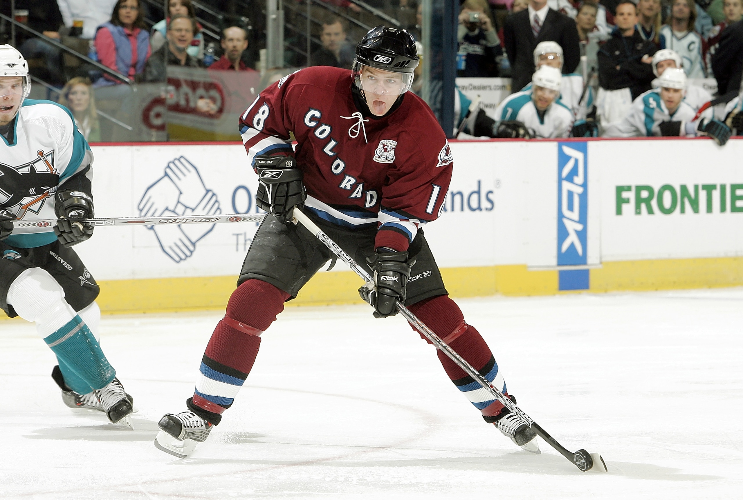 DENVER - NOVEMBER 8:  Alex Tanguay #18 of the Colorado Avalanche scores against the San Jose Sharks in the first period on November 8, 2005 at the Pepsi Center in Denver, Colorado.  (Photo by Brian Bahr/Getty Images)