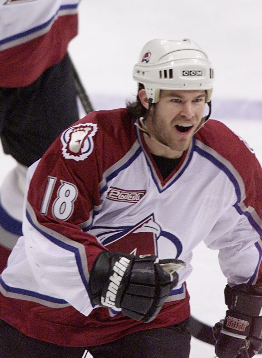 27 Apr 2000:  Adam Deadmarsh #18 of the Colorado Avalanche pumps his fist after Peter Forsberg #21 and he scored against the Detroit Red Wings in the first period during Game 1 of the Western Conference Semifinals at the Pepsi Center in Denver, Colorado.