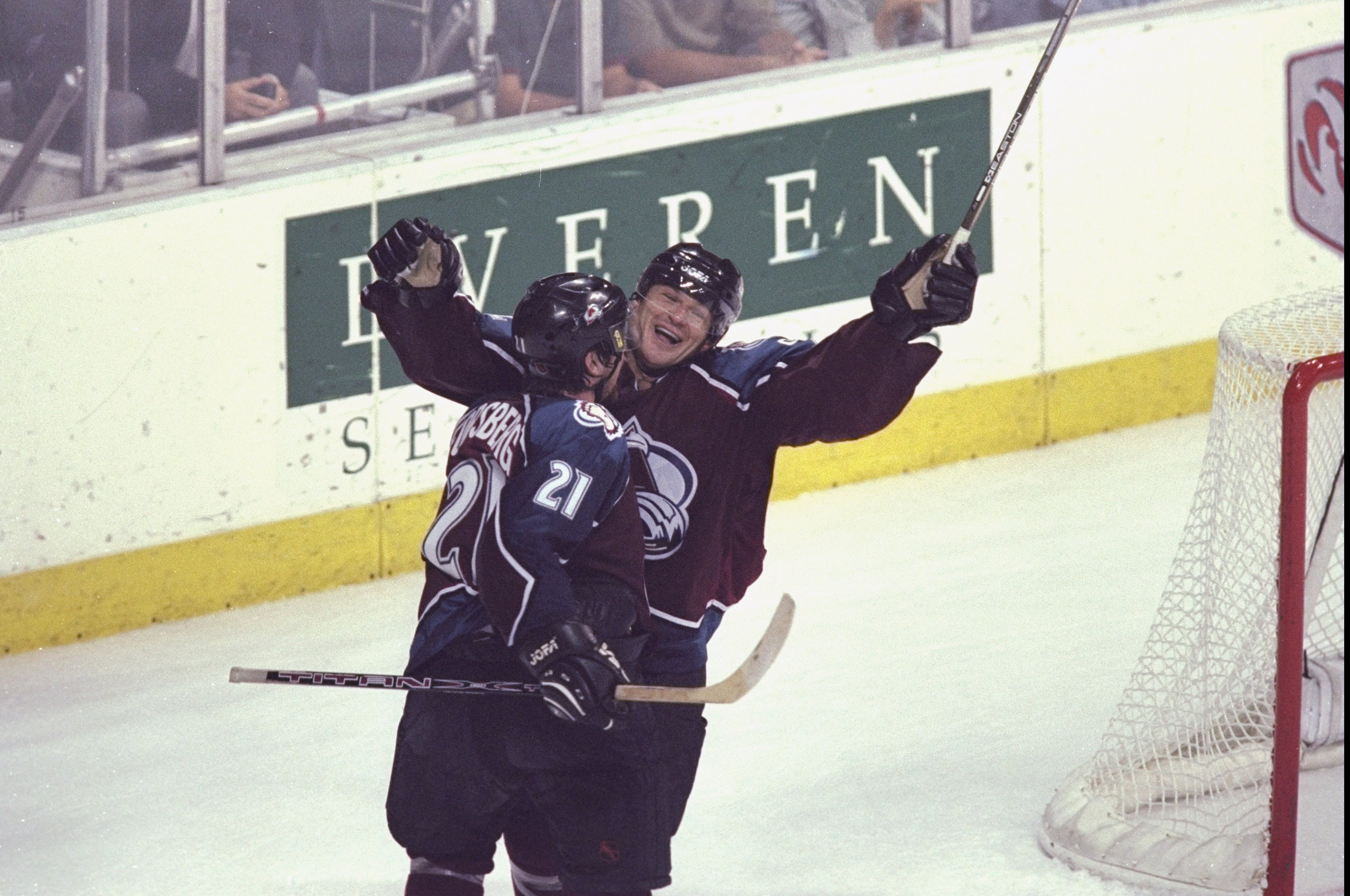 30 May 1999: Peter Forsberg #21of the Colorado Avalanche hugs teammate Claude Lemieux #22 during game five of the Western Confrence Finals against the Dallas Stars at the Reunion Arena in Dallas, Texas. The Avalanche defeated the Stars 7-5. Mandatory Cred
