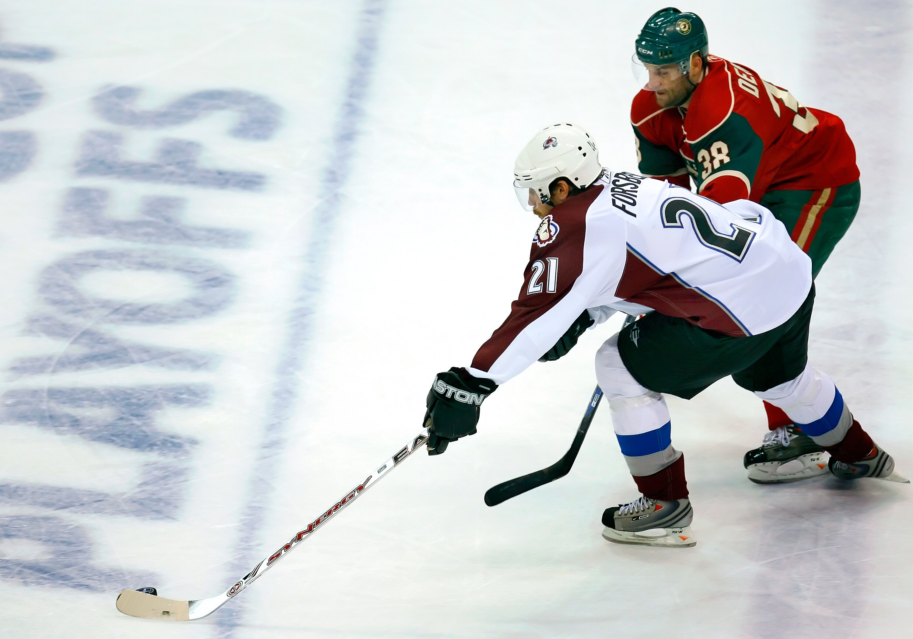 ST. PAUL, MN - APRIL 11:   Peter Forsberg #21 of the Colorado Avalanche tries to skate past Pavol Demitra #38 of the Minnesota Wild during game two of the 2008 NHL Western Conference Quarterfinals on April 11, 2008 at the Xcel Energy Center in St. Paul, M