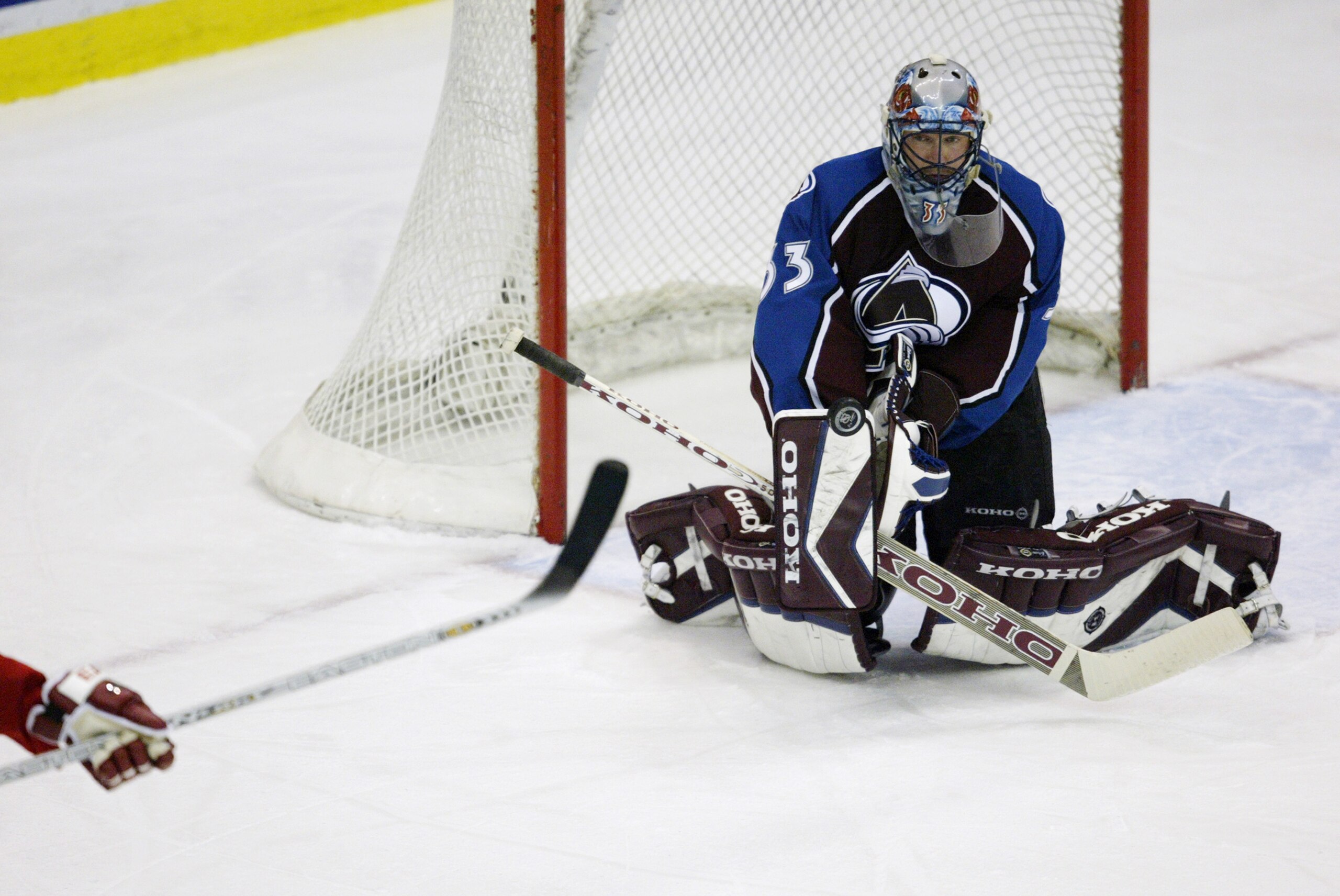 DETROIT - FEBRUARY 6:  Patrick Roy #33 of the Colorado Avalanche makes a save against the Detroit Red Wings at Joe Louis Arena on February 6, 2003 in Detroit, Michigan.  The Avalanche defeated the Red Wings 1-0.  (Photo by Tom Pidgeon/Getty Images/NHLI)