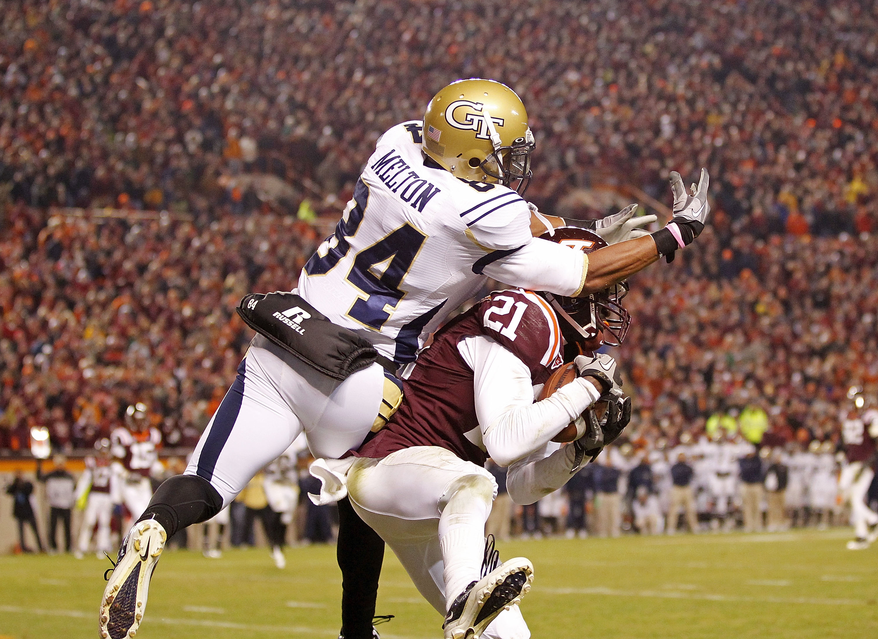 BLACKSBURG, VA - NOVEMBER 04:  Cornerback Rashad Carmichael #21 of the Virginia Tech Hokies intercepts a pass in the end zone in the final seconds intended for wide receiver Tyler Melton #84 of the Georgia Tech Yellow Jackets at Lane Stadium on November 4