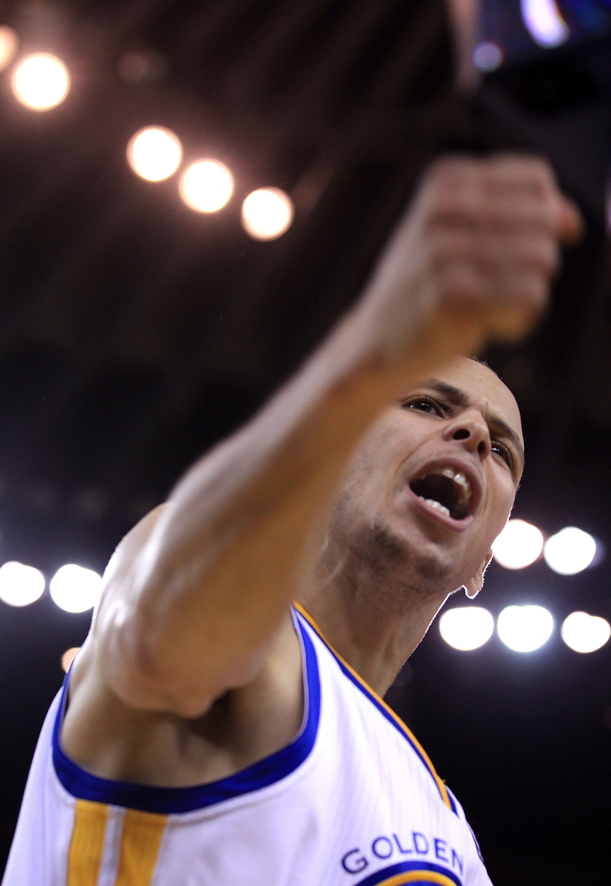 OAKLAND, CA - JANUARY 21:  Stephen Curry #30 of the Golden State Warriors reacts after he made a basket during their game against the Sacramento Kings at Oracle Arena on January 21, 2011 in Oakland, California. NOTE TO USER: User expressly acknowledges an
