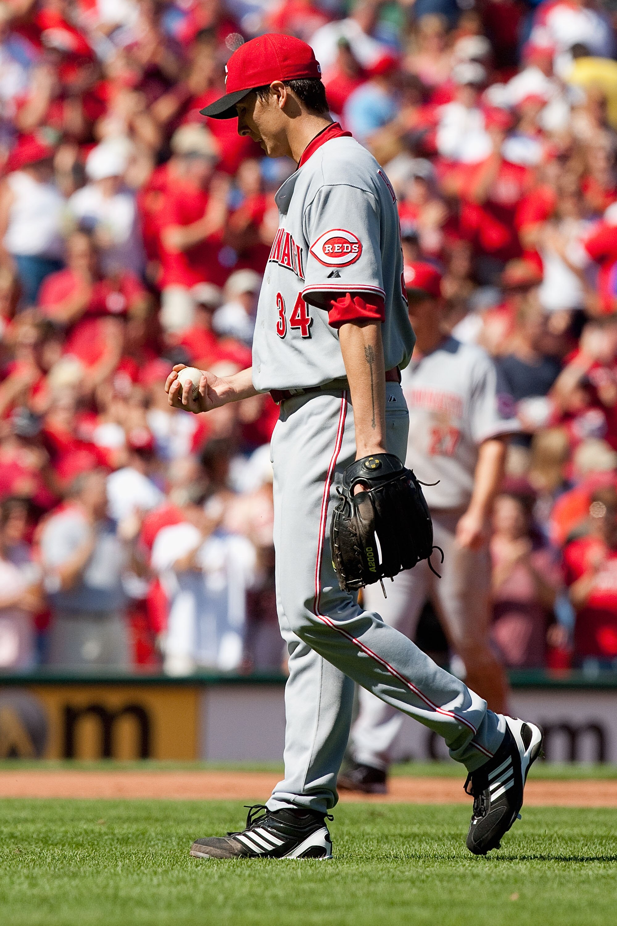 ST. LOUIS - SEPTEMBER 5: Homer Bailey #34 of the Cincinnati Reds reacts to giving up a three-run home run against the St. Louis Cardinals at Busch Stadium on September 5, 2010 in St. Louis, Missouri.  The Cardinals beat the Reds 4-2.  (Photo by Dilip Vish