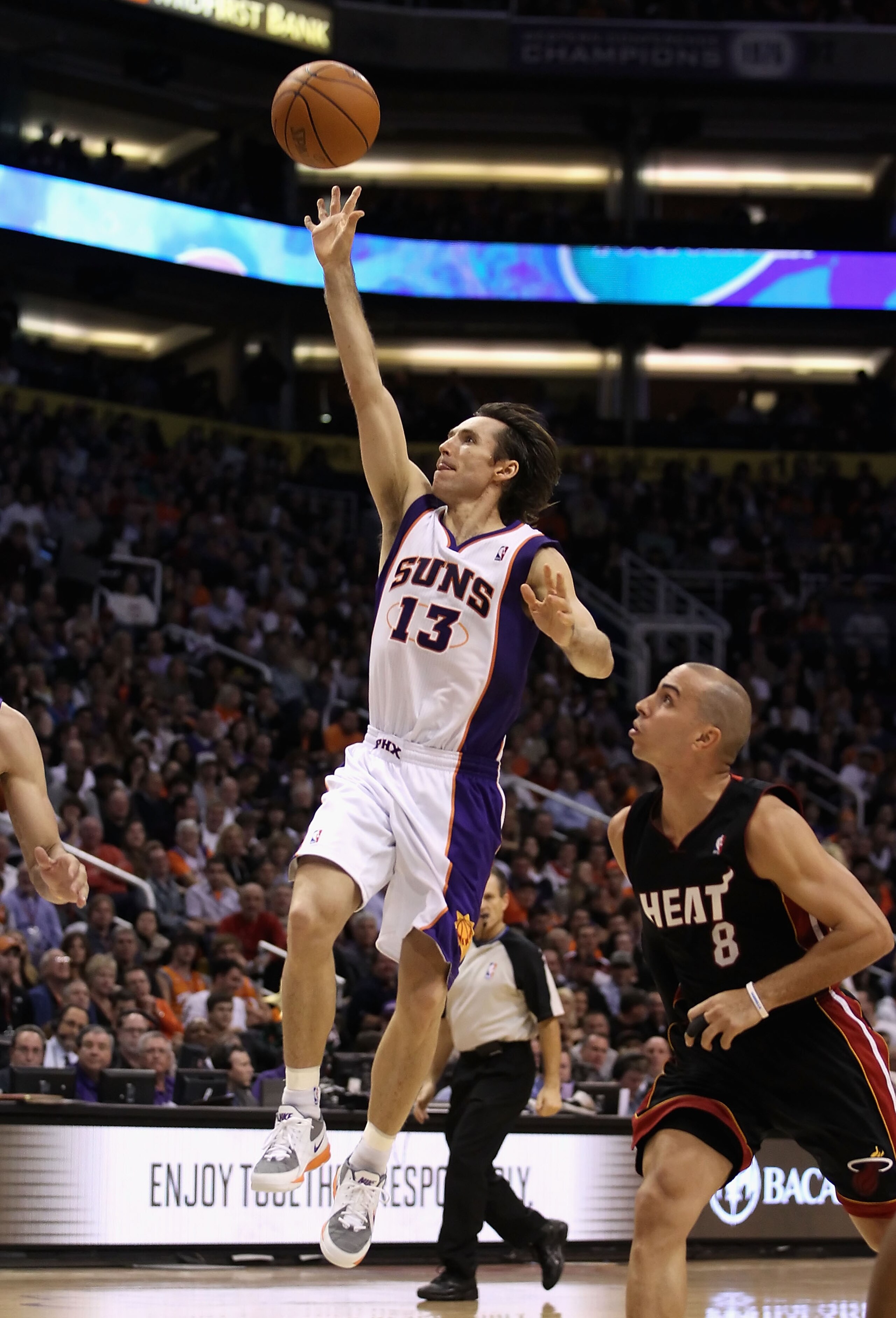 PHOENIX - DECEMBER 23: Steve Nash #13 of the Phoenix Suns puts up a shot against the Miami Heat during the NBA game at US Airways Center on December 23, 2010 in Phoenix, Arizona. NOTE TO USER: User expressly acknowledges and agrees that, by downloading a PHOENIX - DECEMBER 23: Steve Nash #13 of the Phoenix Suns puts up a shot against the Miami Heat during the NBA game at US Airways Center on December 23, 2010 in Phoenix, Arizona. NOTE TO USER: User expressly acknowledges and agrees that, by downloading a