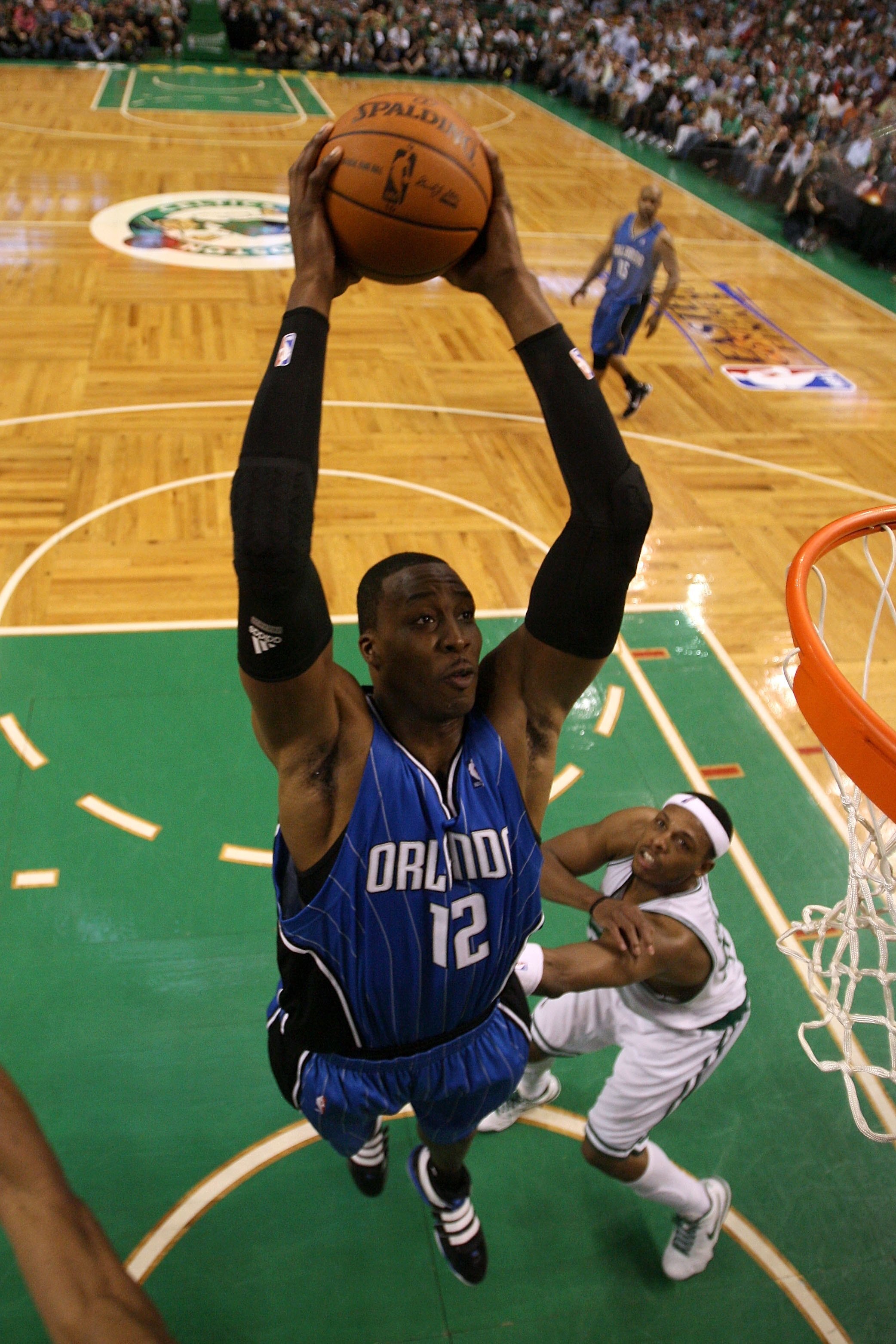 BOSOTN - MAY 24:  Dwight Howard #12 of the Orlando Magic dunks against Paul Pierce #34 of the Boston Celtics in Game Four of the Eastern Conference Finals during the 2010 NBA Playoffs at TD Banknorth Garden on May 24, 2010 in Boston, Massachusetts.  NOTE