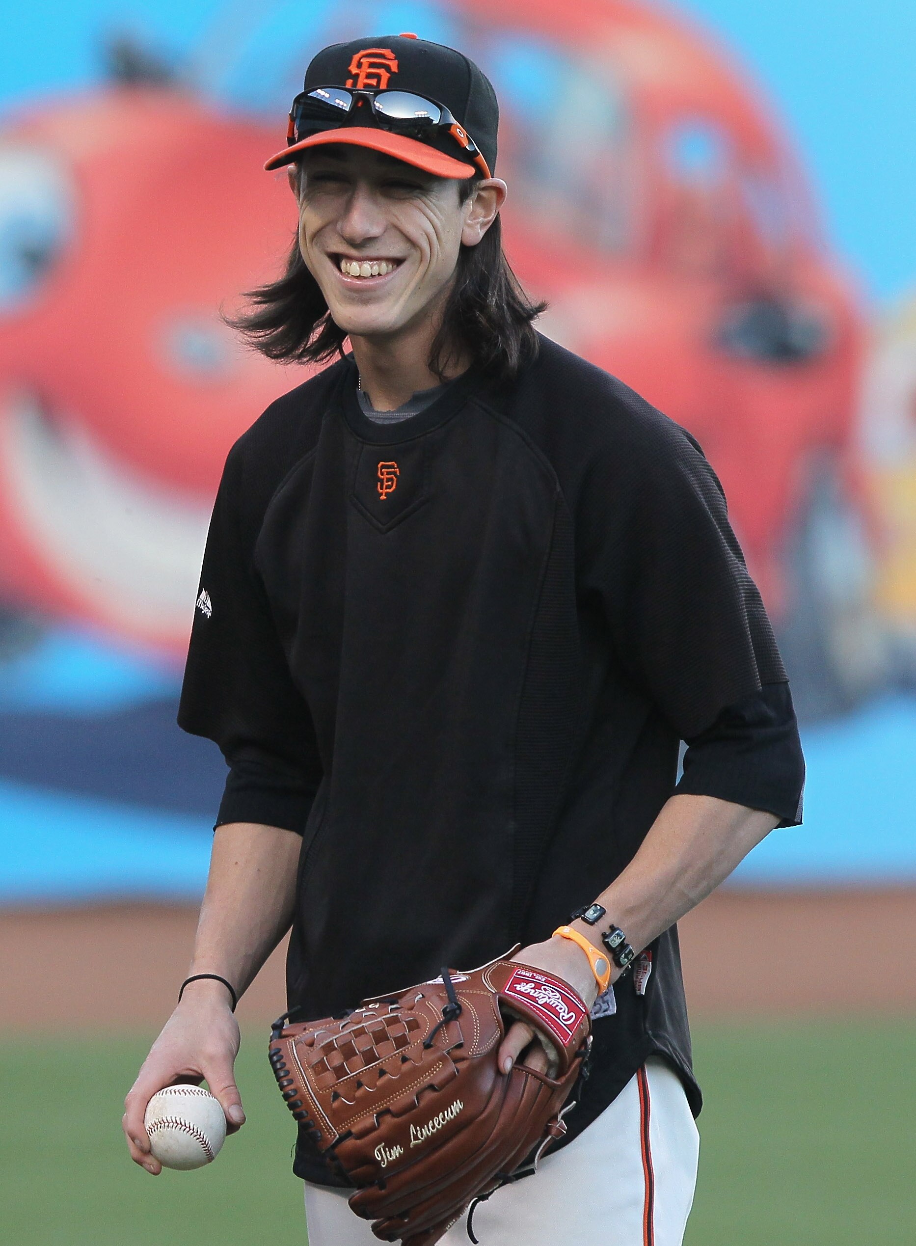 SAN FRANCISCO - OCTOBER 25:  Tim Lincecum #55 of the San Francisco Giants laughs during a team workout at AT&T Park on October 25, 2010 in San Francisco, California. The Giants are preparing to face the Texas Rangers in the 2010 World Series.  (Photo by J