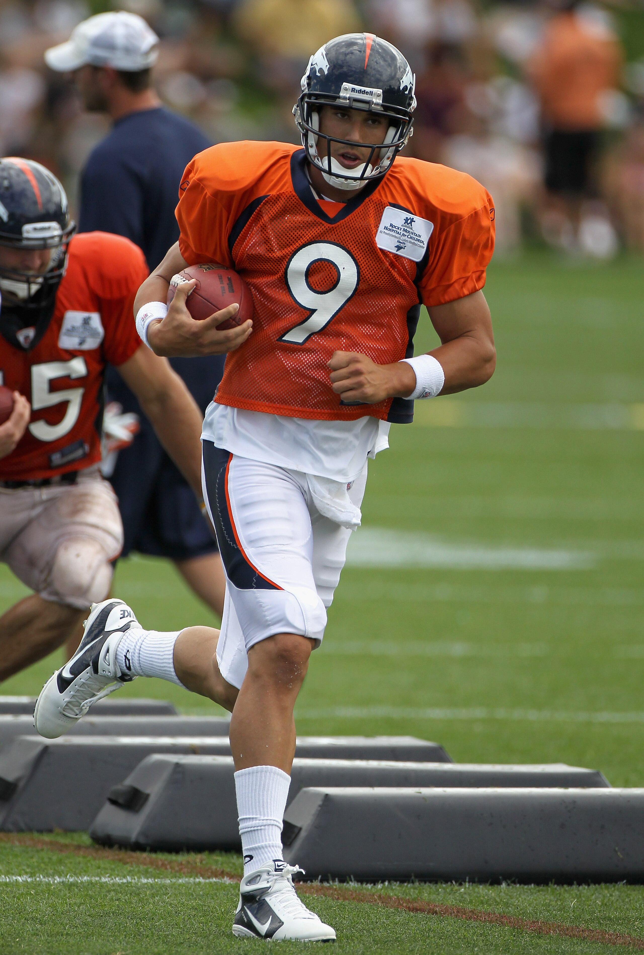 ENGLEWOOD, CO - AUGUST 05:  Quarterback Brady Quinn #9 of the Denver Bronocs takes part in practice during training camp at Dove Valley on August 5, 2010 in Englewood, Colorado.  (Photo by Doug Pensinger/Getty Images)