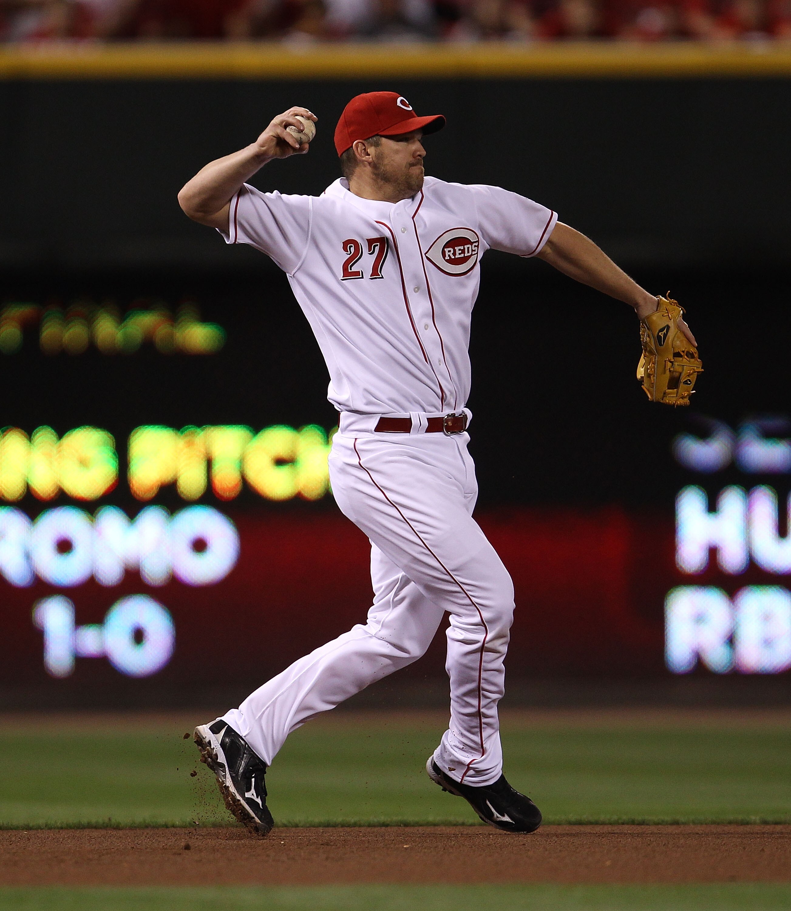 CINCINNATI - OCTOBER 10: Scott Rolen #27 of the Cincinnati Reds throws to 2nd base against the Philadelphia Phillies during game 3 of the NLDS at Great American Ball Park on October 10, 2010 in Cincinnati, Ohio. The Phillies defeated the Reds 2-0.  (Photo