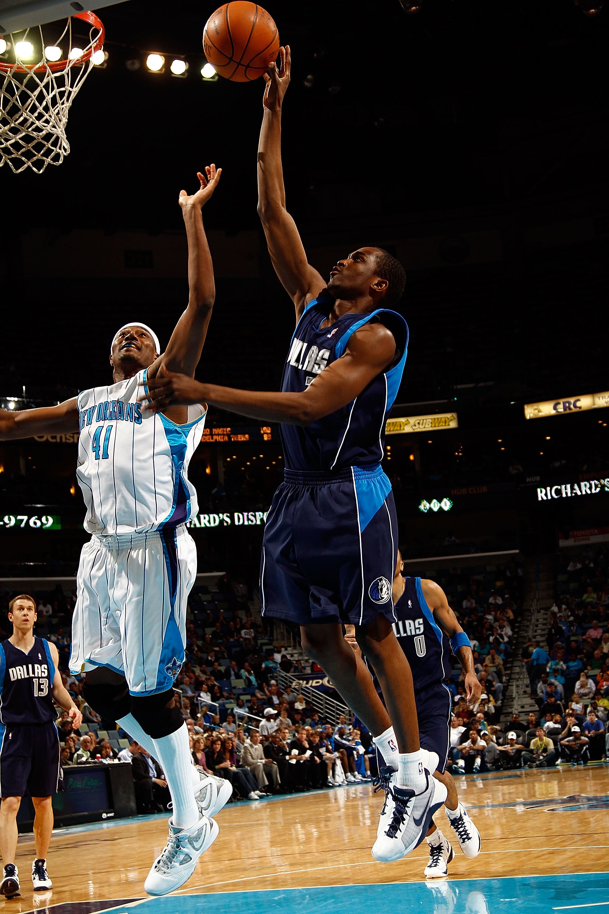 NEW ORLEANS - MARCH 22:  Rodrigue Beaubois #3 of the Dallas Mavericks shoots the ball over James Posey #41 of the New Orleans Hornets at the New Orleans Arena on March 22, 2010 in New Orleans, Louisiana.  The Hornets defeated the Mavericks 115-99.   NOTE