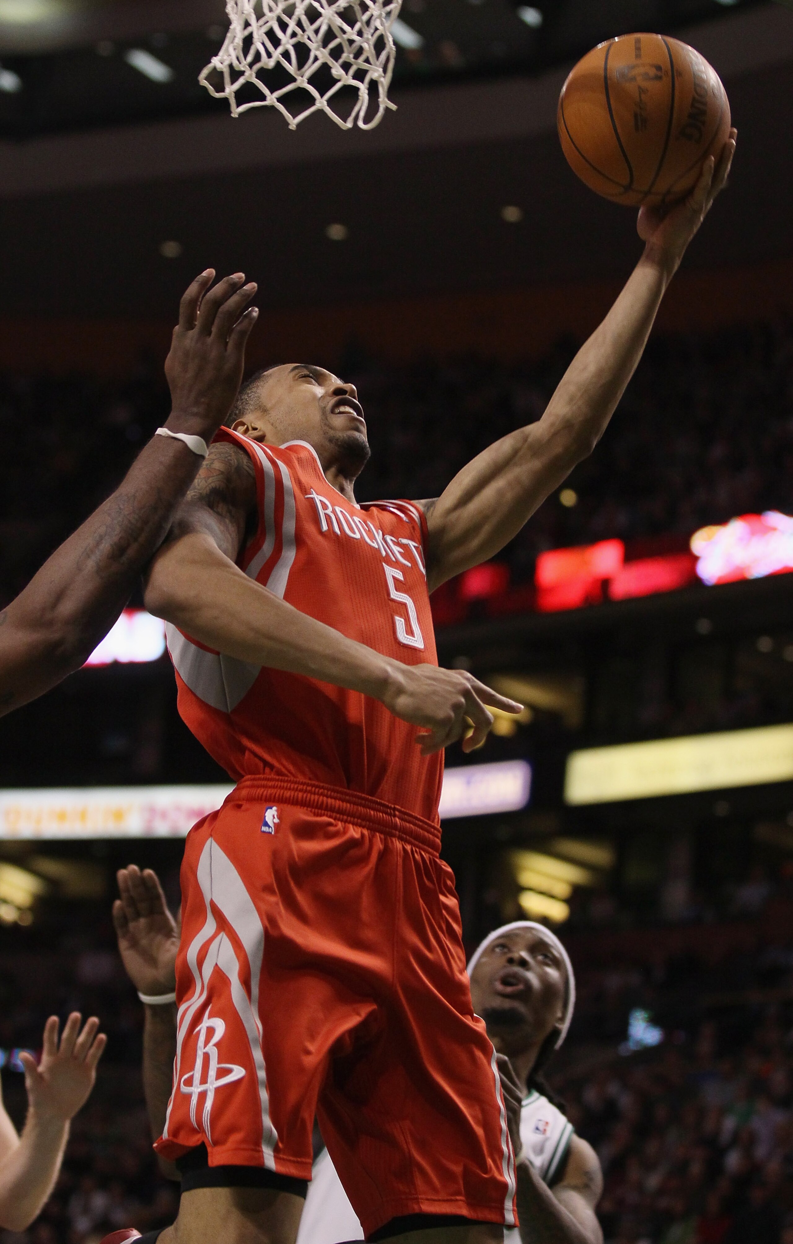 BOSTON, MA - JANUARY 10: Courtney Lee #5 of the Houston Rockets takes a shot as Marquis Daniels #8 of the Boston Celtics defends on January 10, 2011 at the TD Garden in Boston, Massachusetts. The Rockets defeated the Celtics 108-102. NOTE TO USER: User BOSTON, MA - JANUARY 10: Courtney Lee #5 of the Houston Rockets takes a shot as Marquis Daniels #8 of the Boston Celtics defends on January 10, 2011 at the TD Garden in Boston, Massachusetts. The Rockets defeated the Celtics 108-102. NOTE TO USER: User