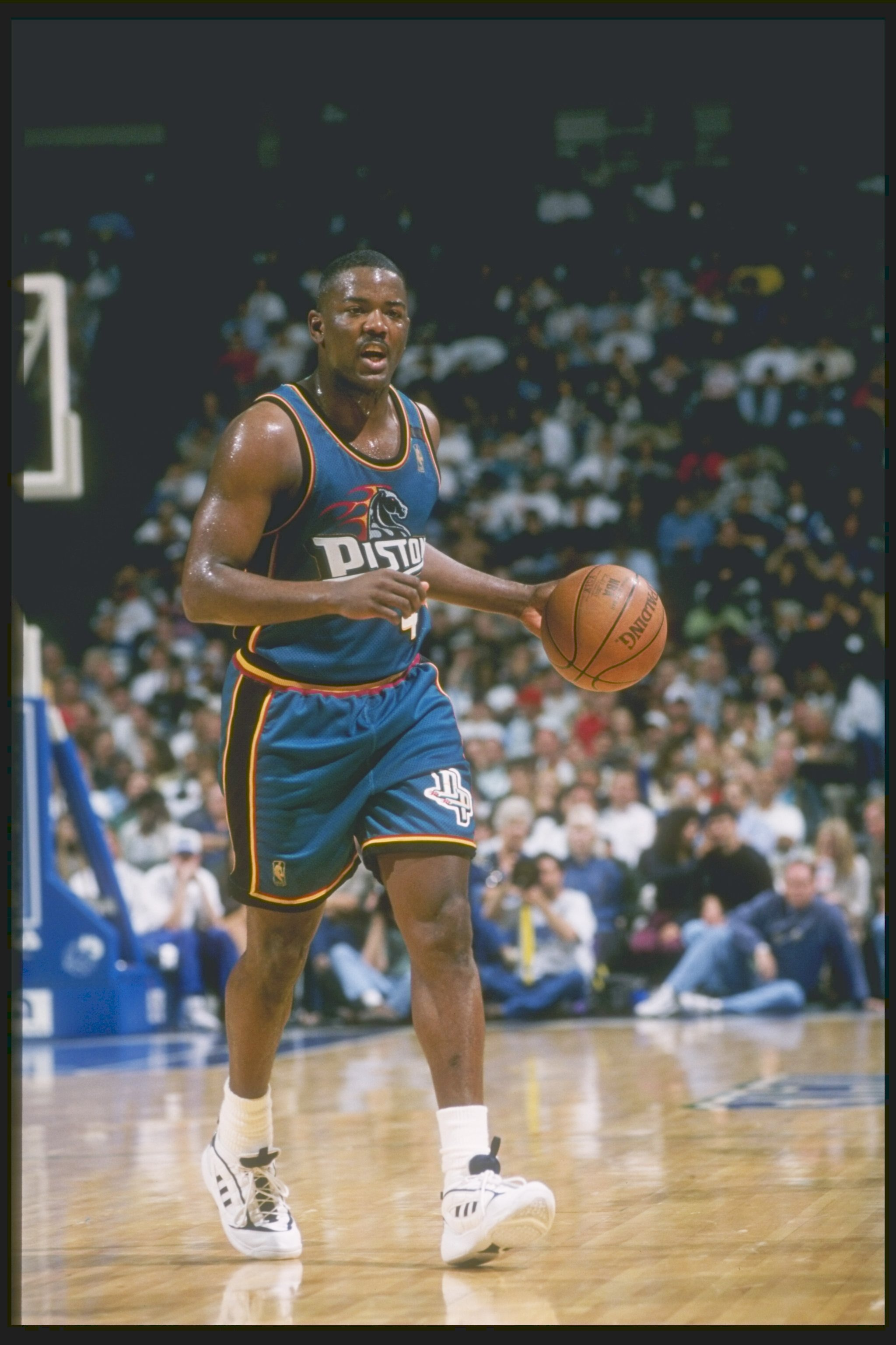 Guard Joe Dumars of the Detroit Pistons dribbles the ball down the court during a game against the Dallas Mavericks at Reunion Arena in Dallas, Texas. The Pistons won the game 100-82.