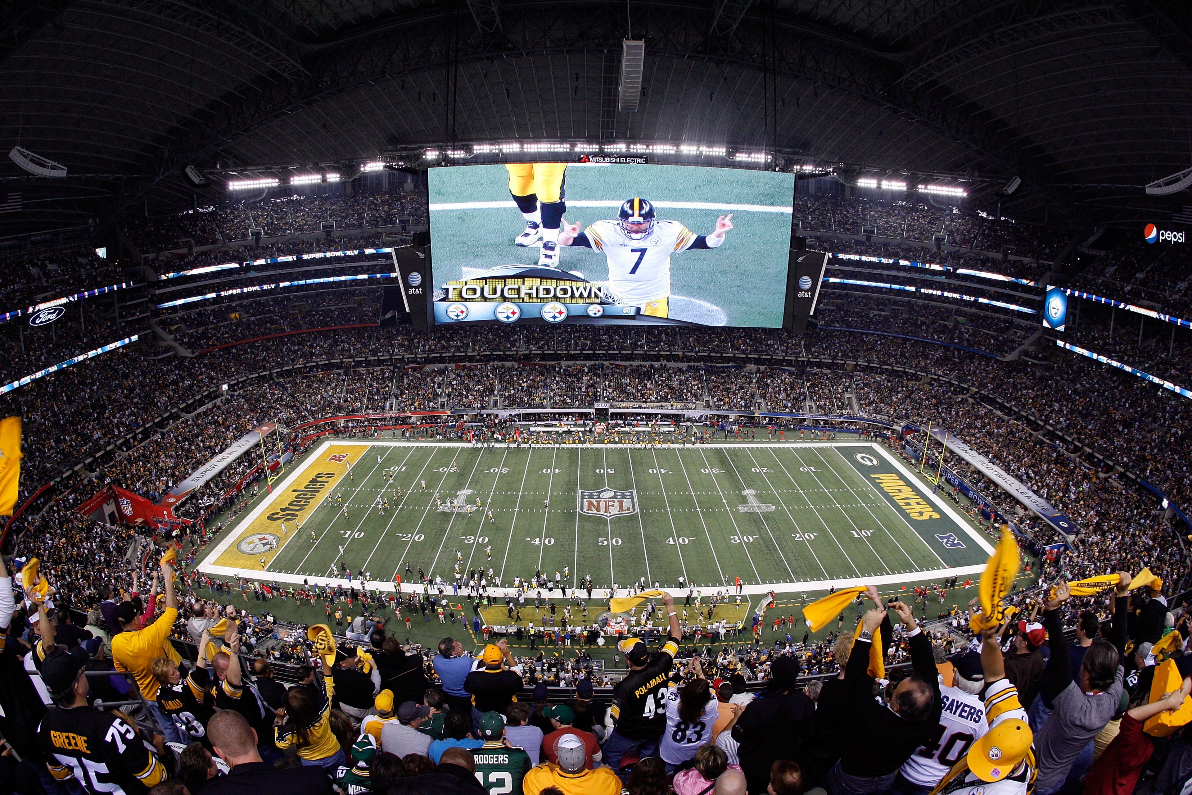 ARLINGTON, TX - FEBRUARY 06:  Quarterback Ben Roethlisberger #7 of the Pittsburgh Steelers is seen on the screen after the Steelers score a touchdown in the second half while taking on the Green Bay Packers during Super Bowl XLV at Cowboys Stadium on Febr