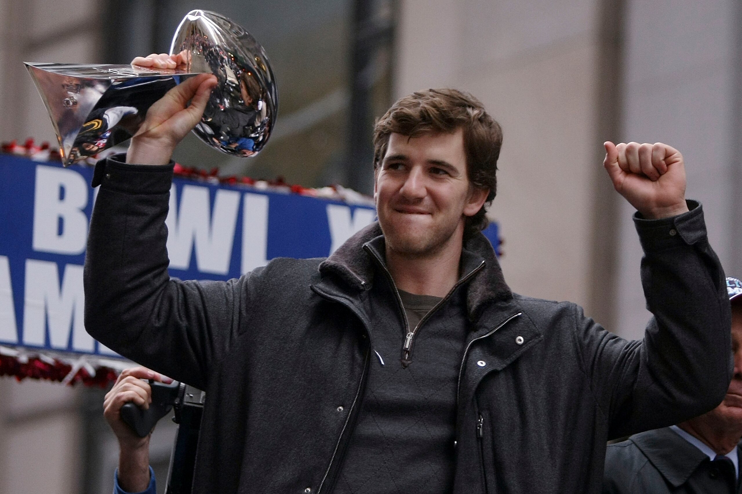 NEW YORK - FEBRUARY 05:  New York Giants quarterback Eli Manning holds up the Vince Lombardi trophy during the New York Giants Superbowl XLII victory parade February 5, 2008 in New York City.  (Photo by Chris McGrath/Getty Images)