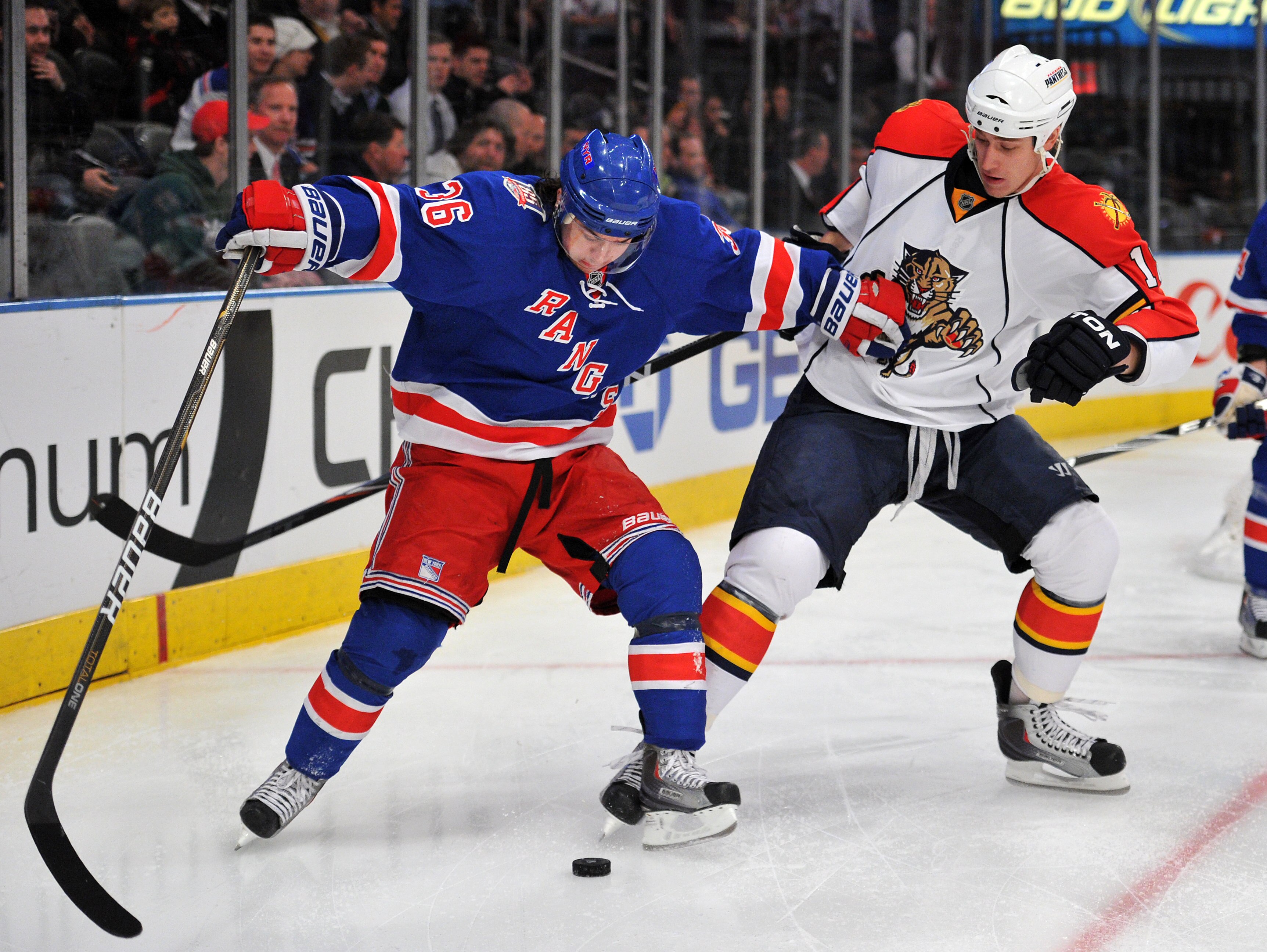 NEW YORK, NY - JANUARY 25: Mats Zuccarello #36 of the New York Rangers holds off Shawn Matthias #18 of the Florida Panthers as they play for possession of the puck during the first period at Madison Square Garden on January 25, 2011 in New York City. (Pho