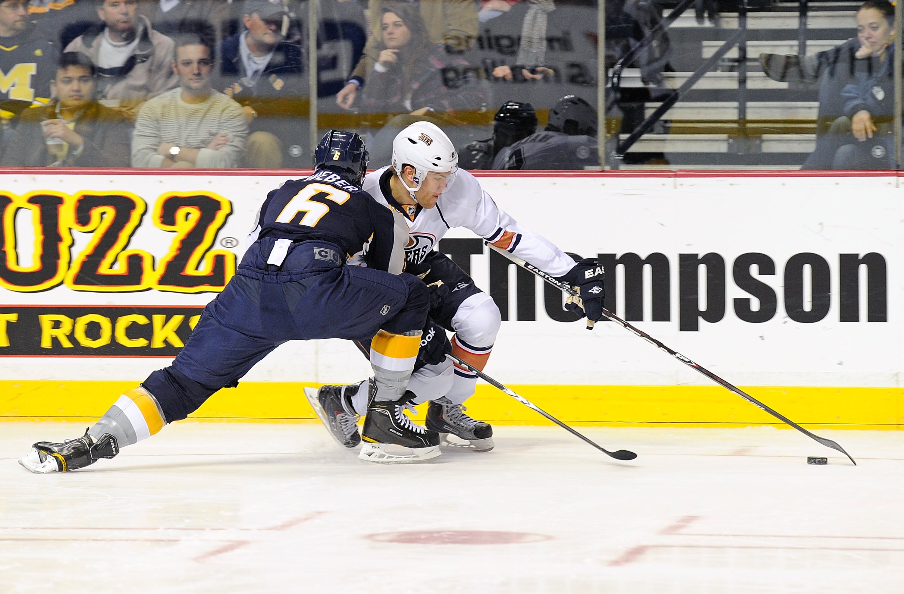 NASHVILLE, TN - FEBRUARY 07:  Shea Weber #6 of the Nashville Predators defends against Taylor Hall #4 of the Edmonton Oilers on February 7, 2011 at the Bridgestone Arena in Nashville, Tennessee.  (Photo by Frederick Breedon/Getty Images)