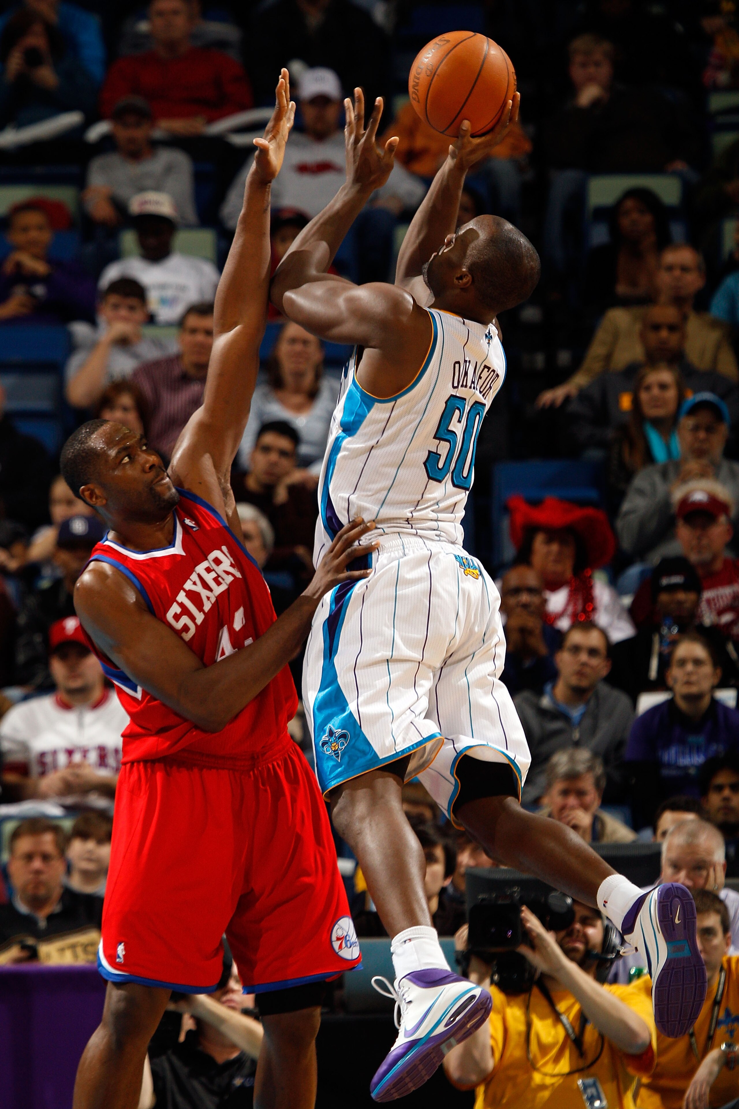NEW ORLEANS, LA - JANUARY 03: Emeka Okafor #50 of the New Orleans Hornets shoots over Elton Brand #42 of the Philadelphia 76ers in the second half at New Orleans Arena on January 3, 2011 in New Orleans, Louisiana. NOTE TO USER: User expressly acknowledge NEW ORLEANS, LA - JANUARY 03: Emeka Okafor #50 of the New Orleans Hornets shoots over Elton Brand #42 of the Philadelphia 76ers in the second half at New Orleans Arena on January 3, 2011 in New Orleans, Louisiana. NOTE TO USER: User expressly acknowledge