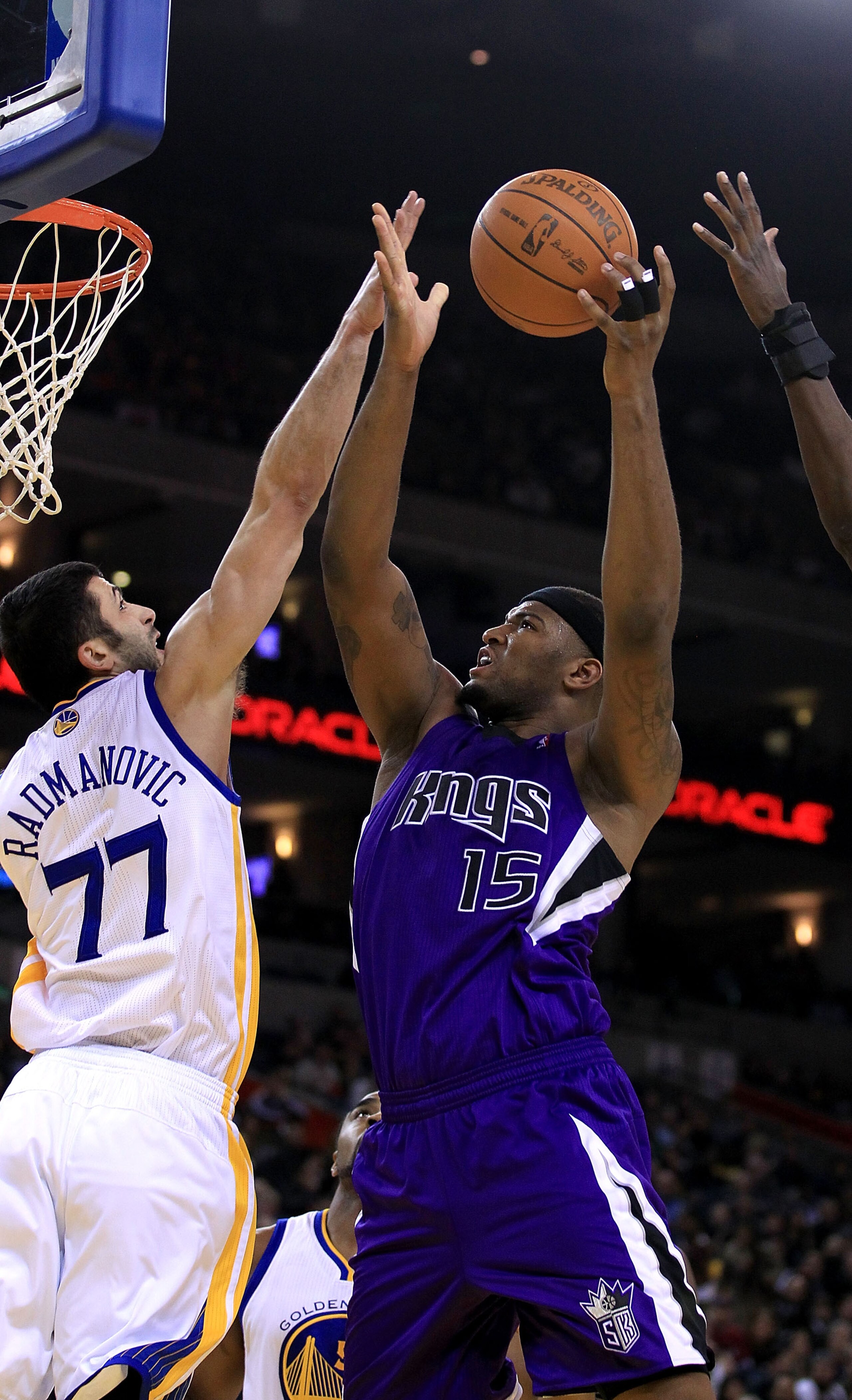 OAKLAND, CA - JANUARY 21: DeMarcus Cousins #15 of the Sacramento Kings goes up for a shot against Vladimir Radmanovic #77 of the Golden State Warriors at Oracle Arena on January 21, 2011 in Oakland, California. NOTE TO USER: User expressly acknowledges a OAKLAND, CA - JANUARY 21: DeMarcus Cousins #15 of the Sacramento Kings goes up for a shot against Vladimir Radmanovic #77 of the Golden State Warriors at Oracle Arena on January 21, 2011 in Oakland, California. NOTE TO USER: User expressly acknowledges a
