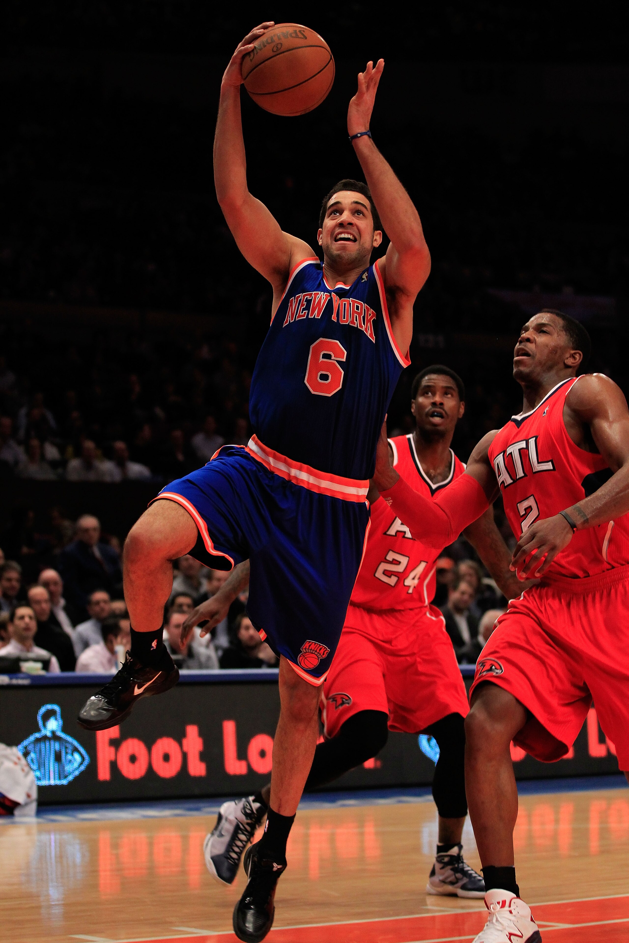 NEW YORK, NY - FEBRUARY 16: Landry Fields #6 of the New York Knicks shoots the ball over Joe Johnson #2 of the Atlanta Hawks at Madison Square Garden on February 16, 2011 in New York City. NOTE TO USER: User expressly acknowledges and agrees that, by down NEW YORK, NY - FEBRUARY 16: Landry Fields #6 of the New York Knicks shoots the ball over Joe Johnson #2 of the Atlanta Hawks at Madison Square Garden on February 16, 2011 in New York City. NOTE TO USER: User expressly acknowledges and agrees that, by down
