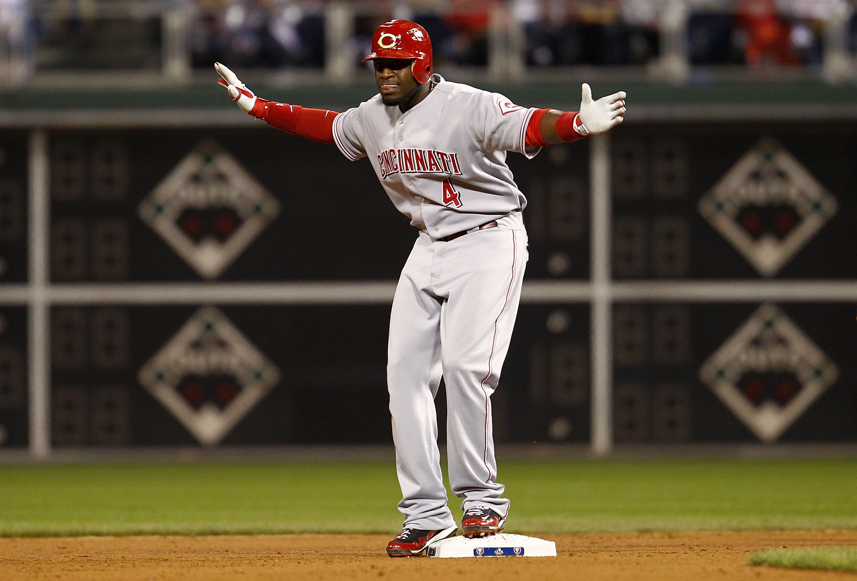 PHILADELPHIA - OCTOBER 08:  Brandon Phillips #4 of the Cincinnati Reds celebrates hitting a double in Game 2 of the NLDS against the Philadelphia Phillies at Citizens Bank Park on October 8, 2010 in Philadelphia, Pennsylvania.  (Photo by Jeff Zelevansky/G