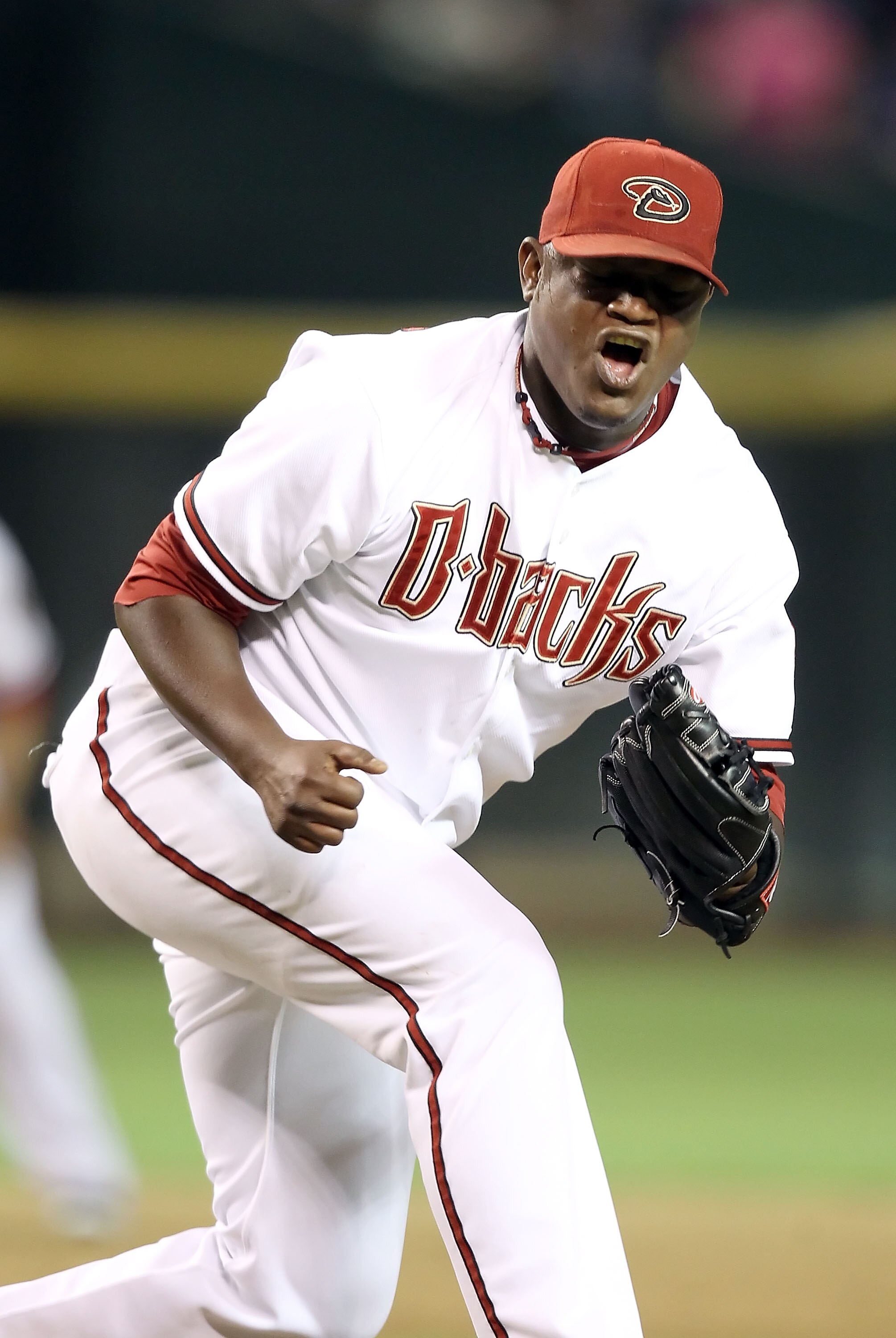 PHOENIX - JULY 20:  Relief pitcher Juan Gutierrez #58 of the Arizona Diamondbacks celebrates after defeating the New York Mets in the Major League Baseball game at Chase Field on July 20, 2010 in Phoenix, Arizona. The Diamondbacks defeated the Mets 3-2.