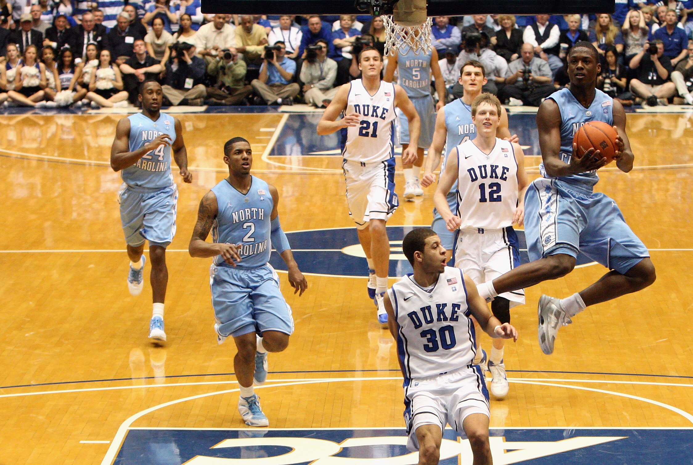 DURHAM, NC - FEBRUARY 09:  Harrison Barnes #40 of the North Carolina Tar Heels drives to the basket against Seth Curry #30 of the Duke Blue Devils during their game at Cameron Indoor Stadium on February 9, 2011 in Durham, North Carolina.  (Photo by Street