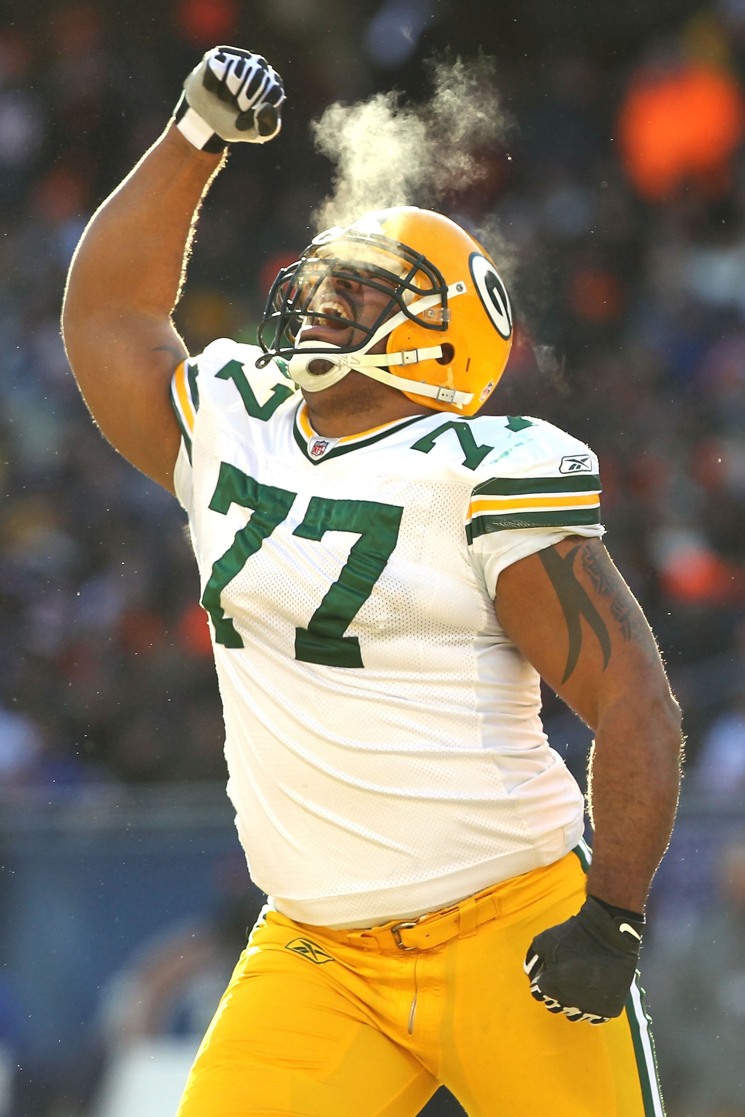 CHICAGO, IL - JANUARY 23: Cullen Jenkins #77 of the Green Bay Packers reacts after a sack of quarterback Jay Cutler #6 of the Chicago Bears in the first half in the NFC Championship Game at Soldier Field on January 23, 2011 in Chicago, Illinois. (Photo CHICAGO, IL - JANUARY 23: Cullen Jenkins #77 of the Green Bay Packers reacts after a sack of quarterback Jay Cutler #6 of the Chicago Bears in the first half in the NFC Championship Game at Soldier Field on January 23, 2011 in Chicago, Illinois. (Photo