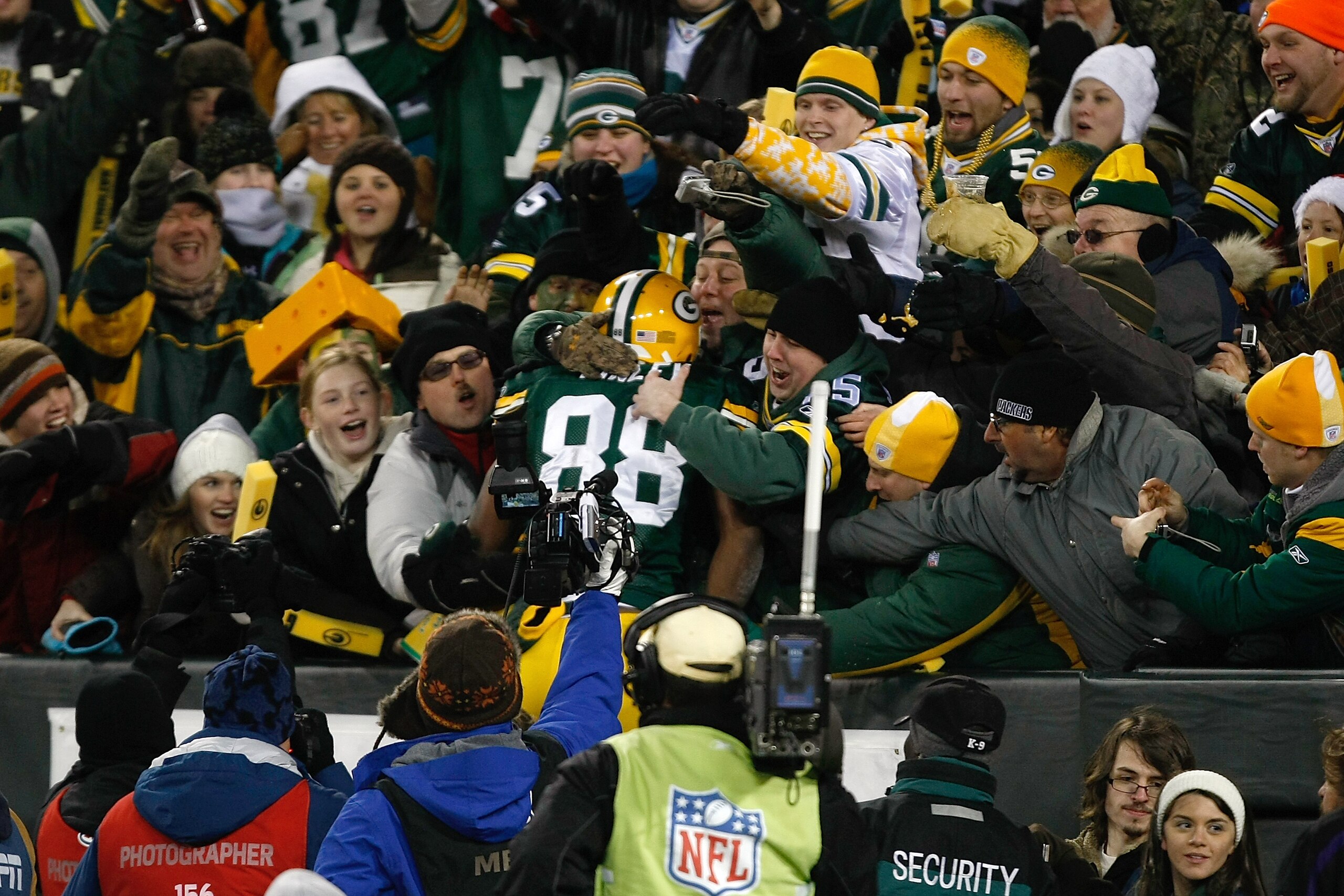 GREEN BAY, WI - DECEMBER 7: Tight end Jermichael Finley #88 of the Green Bay Packers celebrates a touchdown by jumping in the stands with fans for a Lambeau leap in the first half against the Baltimore Ravens at Lambeau Field on December 7, 2009 in Green GREEN BAY, WI - DECEMBER 7: Tight end Jermichael Finley #88 of the Green Bay Packers celebrates a touchdown by jumping in the stands with fans for a Lambeau leap in the first half against the Baltimore Ravens at Lambeau Field on December 7, 2009 in Green