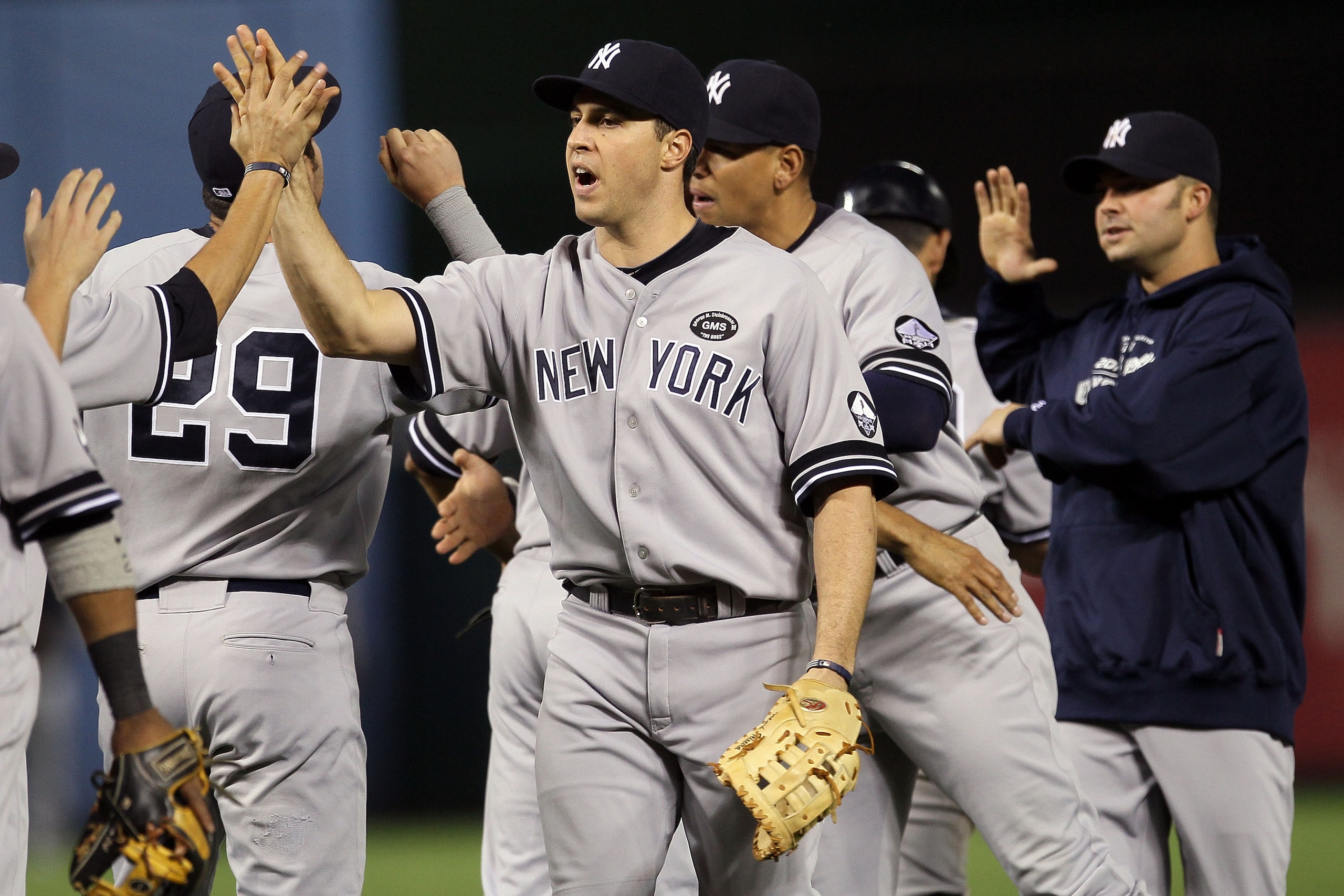 ARLINGTON, TX - OCTOBER 15:  Mark Teixeira #25 and the New York Yankees celebrate after defeating the Texas Rangers by a score of 6-5 to win Game One of the ALCS during the 2010 MLB Playoffs at Rangers Ballpark in Arlington on October 15, 2010 in Arlingto