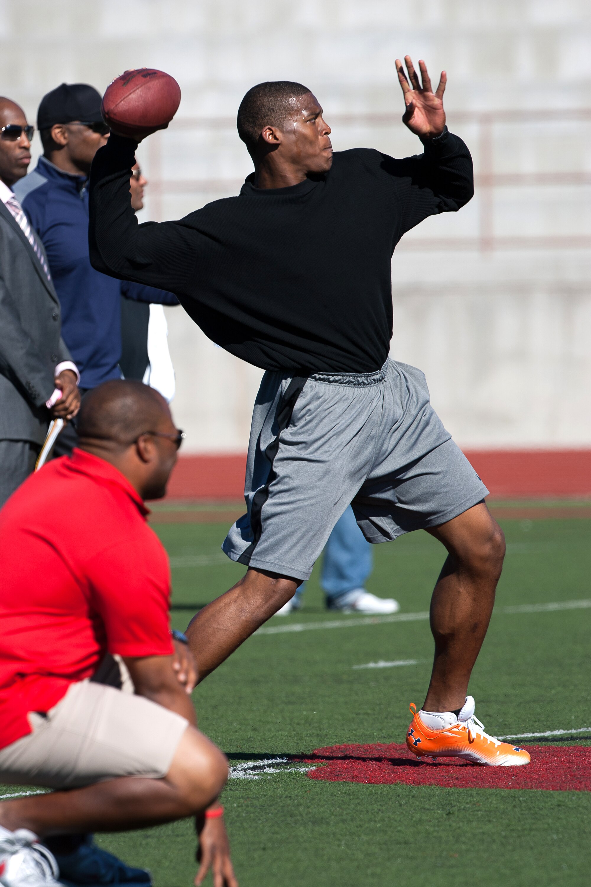 SAN DIEGO, CA - FEBRUARY 10:  2010 Heisman Trophy winning quarterback Cam Newton of the Auburn Tigers goes through his workout routine for the media at Cathedral High School's sports stadium on February 10, 2011 in San Diego, California.  (Photo by Kent H