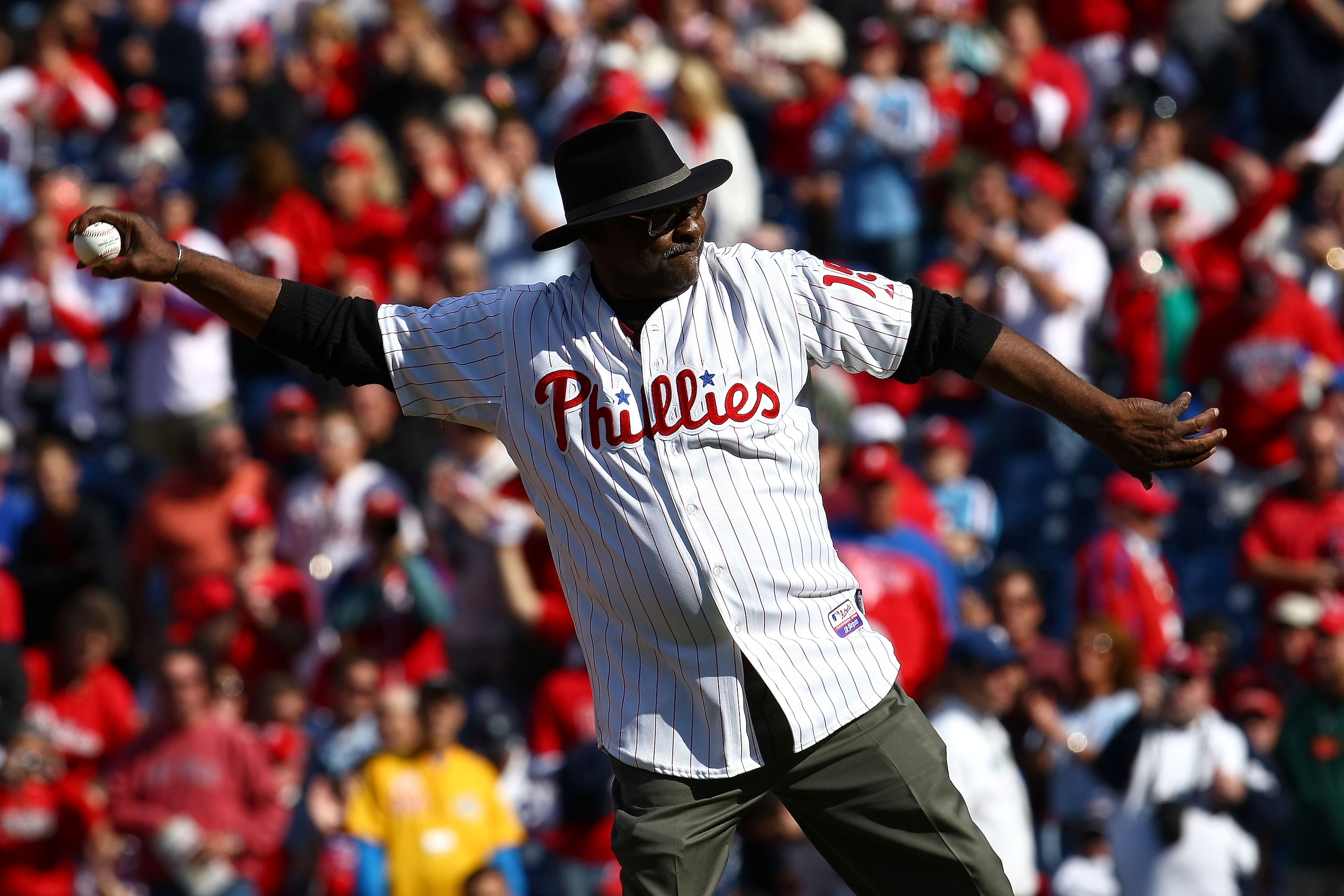 PHILADELPHIA - OCTOBER 07:  Dick Allen, former player for the Philadelphia Phillies throws out the ceremonial first pitch prior to Game One of the NLDS between the Philadelphia Phillies and the Colorado Rockies during the 2009 MLB Playoffs at Citizens Ban