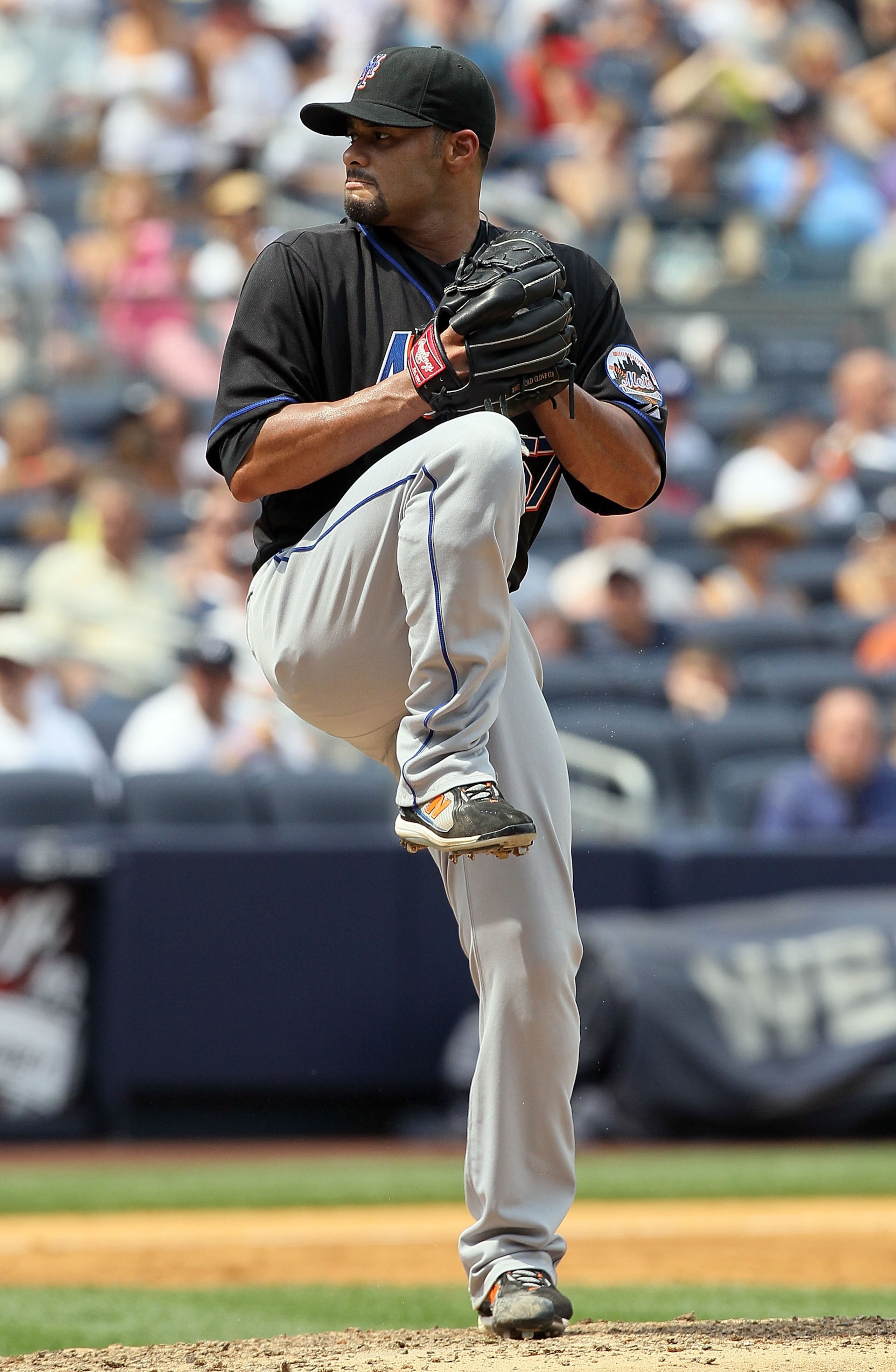 NEW YORK - JUNE 20:  Johan Santana #57 of the New York Mets delivers a pitch against the New York Yankees on June 20, 2010 at Yankee Stadium in the Bronx borough of New York City.  (Photo by Jim McIsaac/Getty Images)