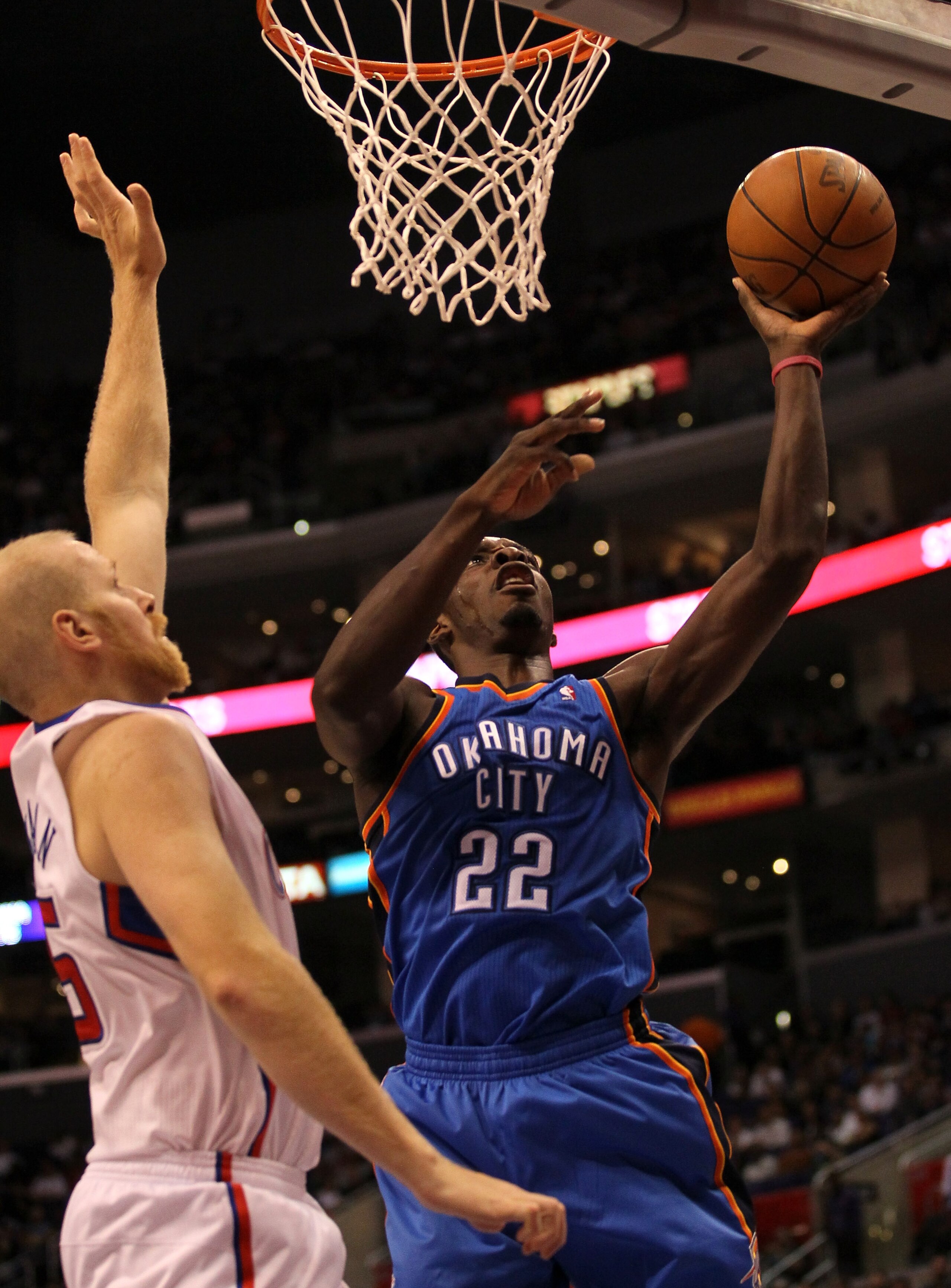 LOS ANGELES - NOVEMBER 3:  Jeff Green #22 of the Oklahoma City Thunder shoots over Chris Kaman #35 of the Los Angeles Clippers at Staples Center on November 3, 2010 in Los Angeles, California.  NOTE TO USER: User expressly acknowledges and agrees that, by