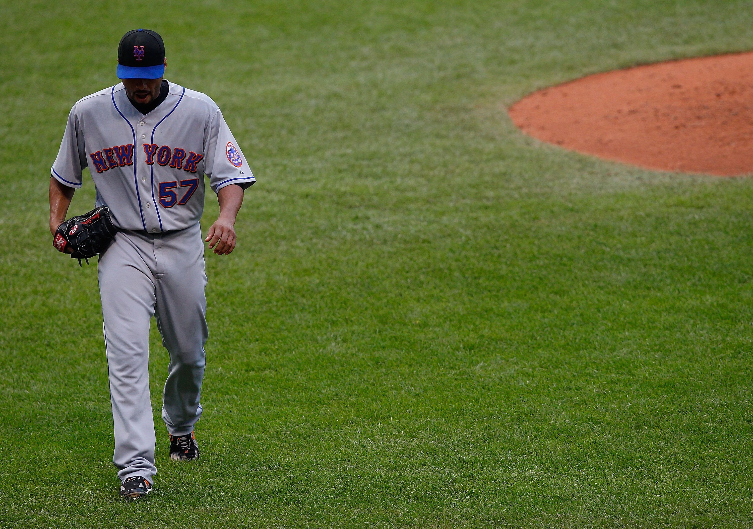 CLEVELAND - JUNE 15:  Johan Santana #57 of the New York Mets walks back to the dugout during the game against the Cleveland Indians on June 15, 2010 at Progressive Field in Cleveland, Ohio.  (Photo by Jared Wickerham/Getty Images)