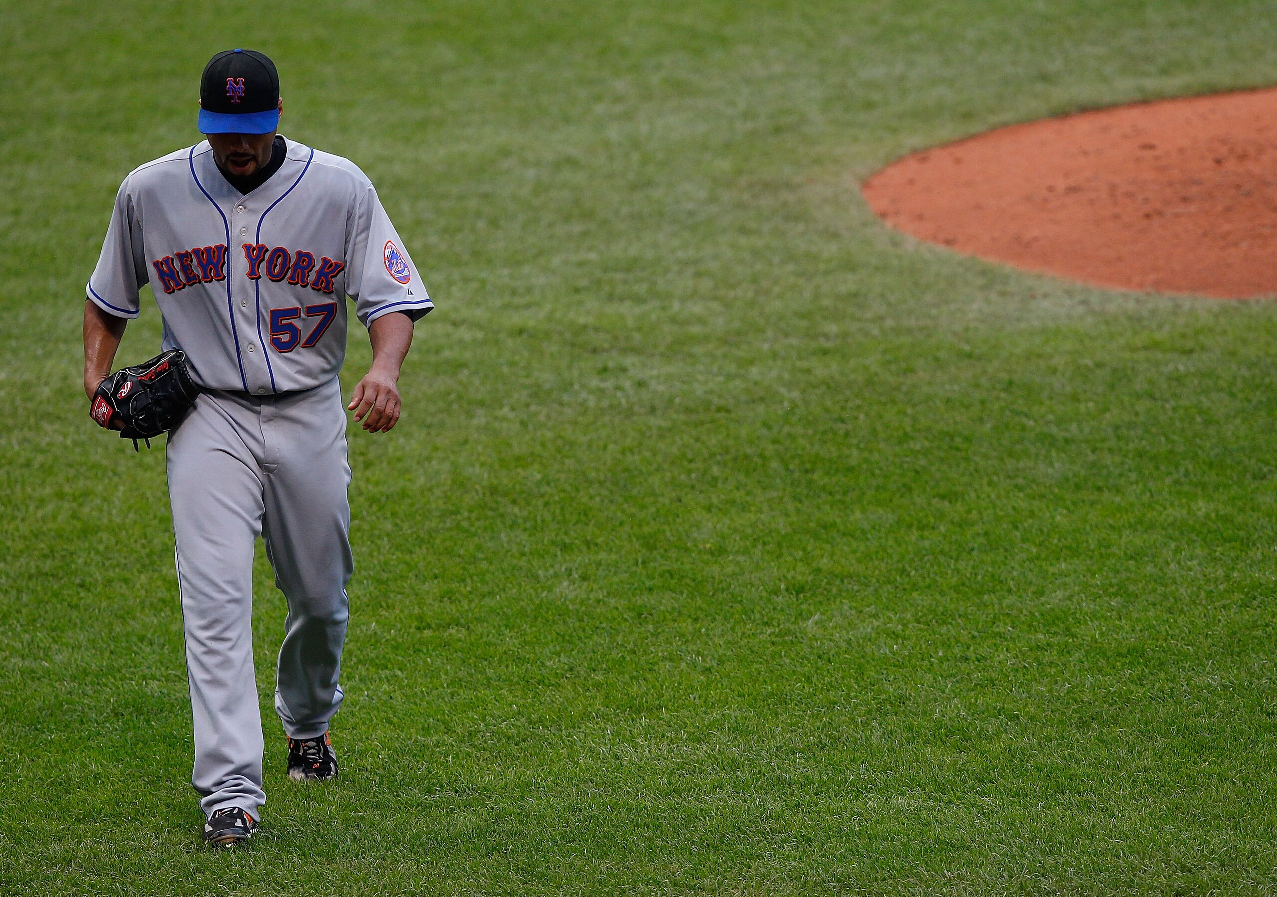 CLEVELAND - JUNE 15:  Johan Santana #57 of the New York Mets walks back to the dugout during the game against the Cleveland Indians on June 15, 2010 at Progressive Field in Cleveland, Ohio.  (Photo by Jared Wickerham/Getty Images)